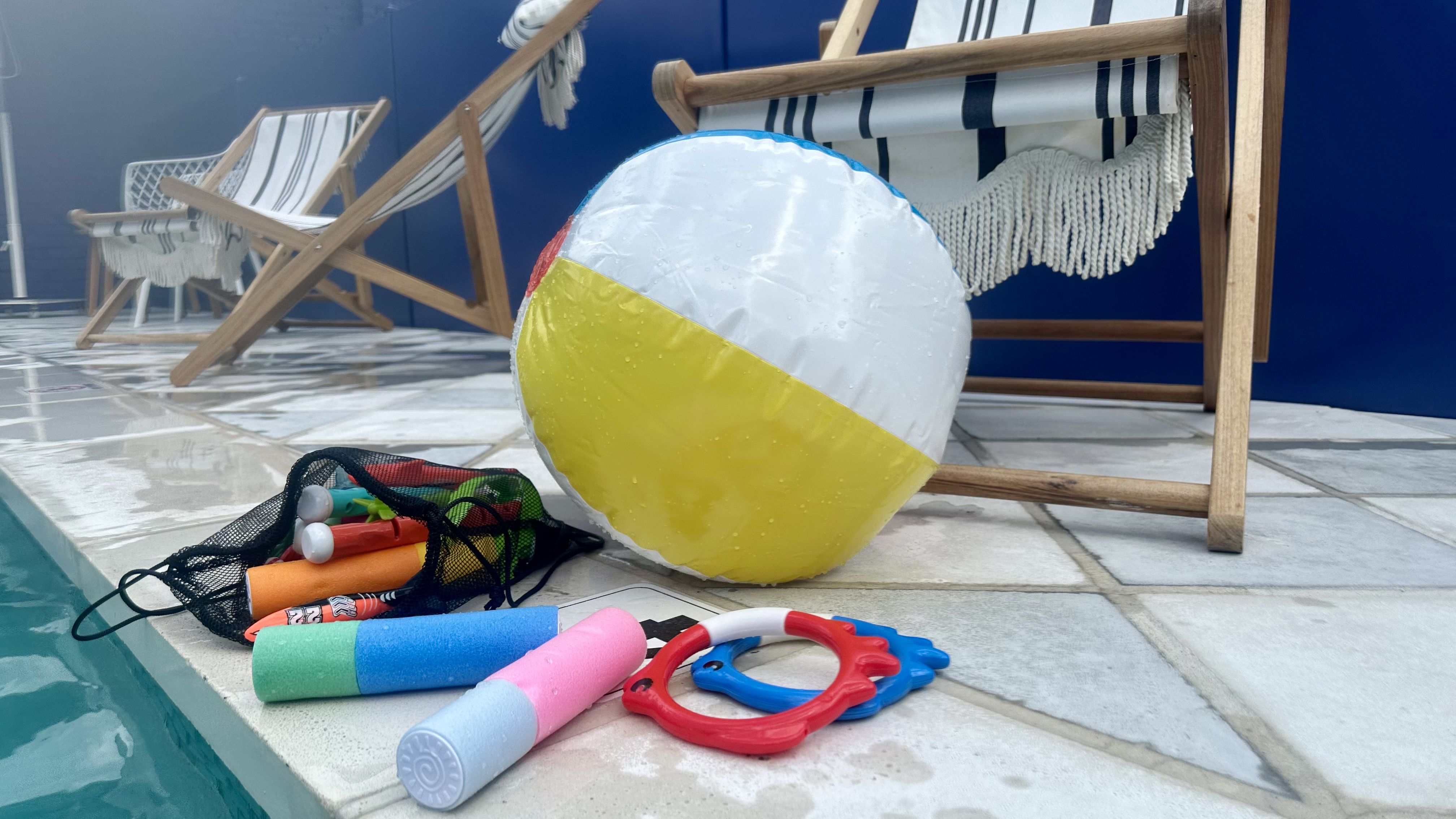 Photo shows pool toys, including an inflatable beach ball.