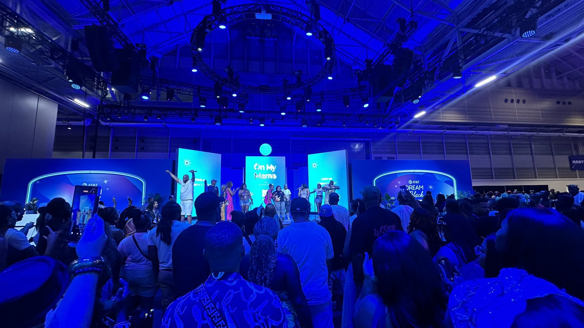 Photo shows a crowd in a blue light.