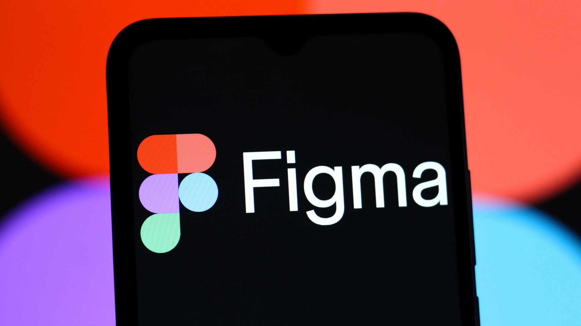 Figma logo on a phone background
