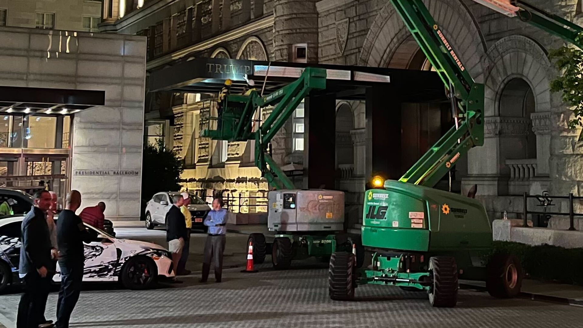 Hours after the Trump Organization's sale was complete, half a dozen workers were dismantling signs from the facade of the building in Washington, D.C.