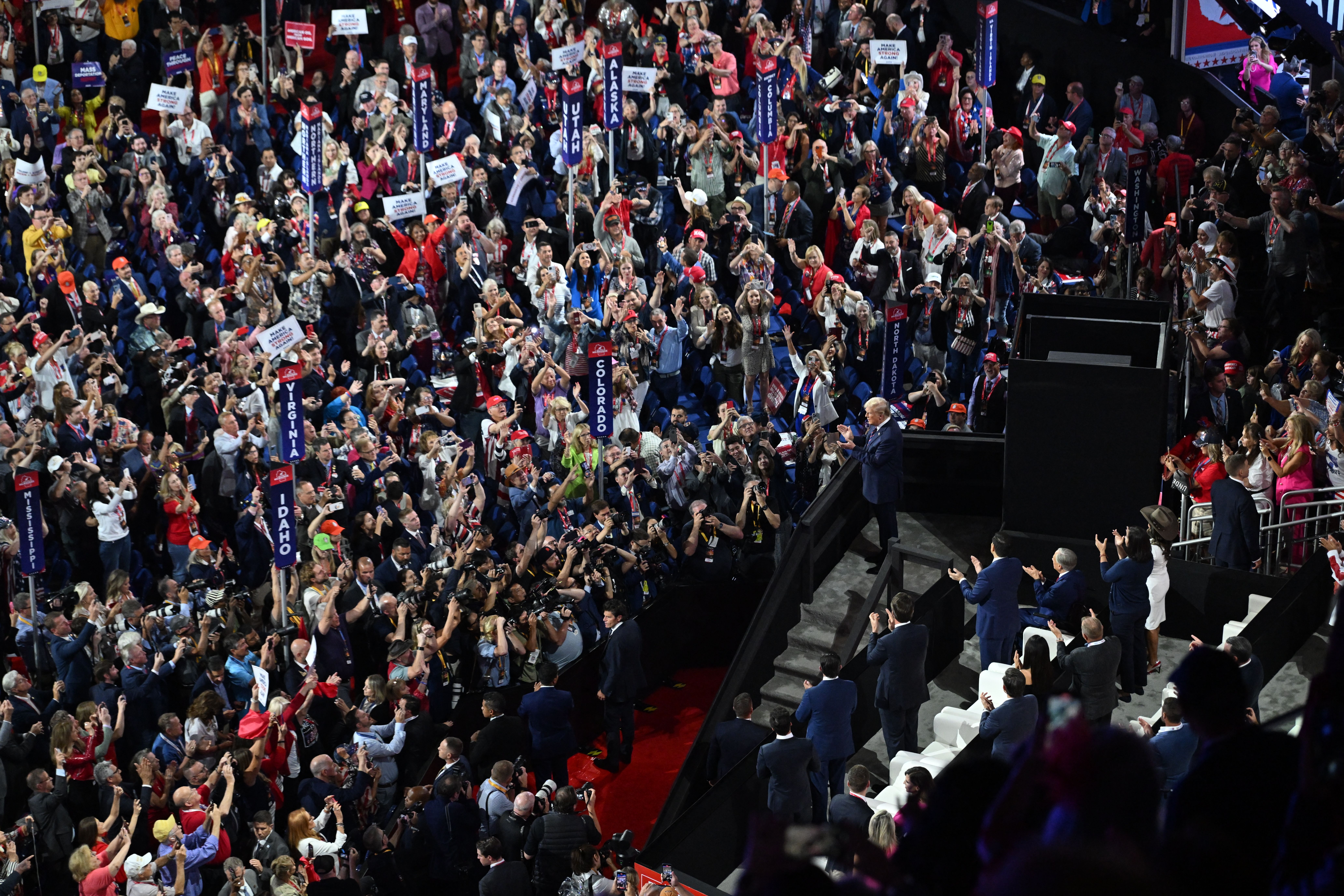 TOPSHOT - Former US President and 2024 Republican presidential candidate Donald Trump receives a standing ovation as he arrives during the third day of the 2024 Republican National Convention at the Fiserv Forum in Milwaukee, Wisconsin, on July 17, 2024. Days after he survived an assassination attem