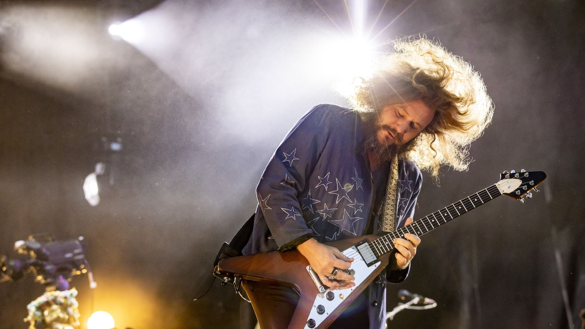 My Morning jacket frontman Jim James plays guitar on stage. 