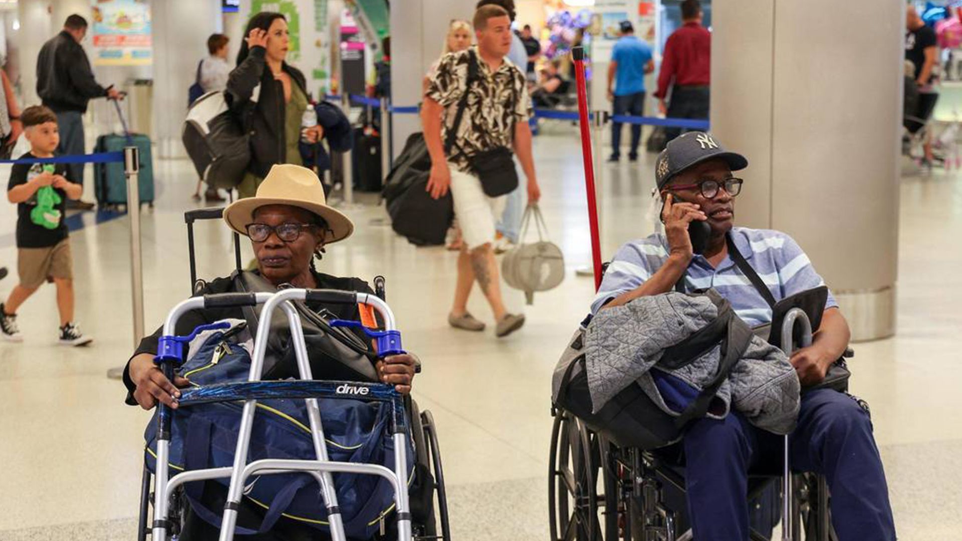  Marie Lucie St. Fleur, left, sits in the Arrivals area after arriving on the first evacuation flight out of Cap-Haitien, Haiti, that landed at Miami International Airport on Sunday, March 17, 2024.