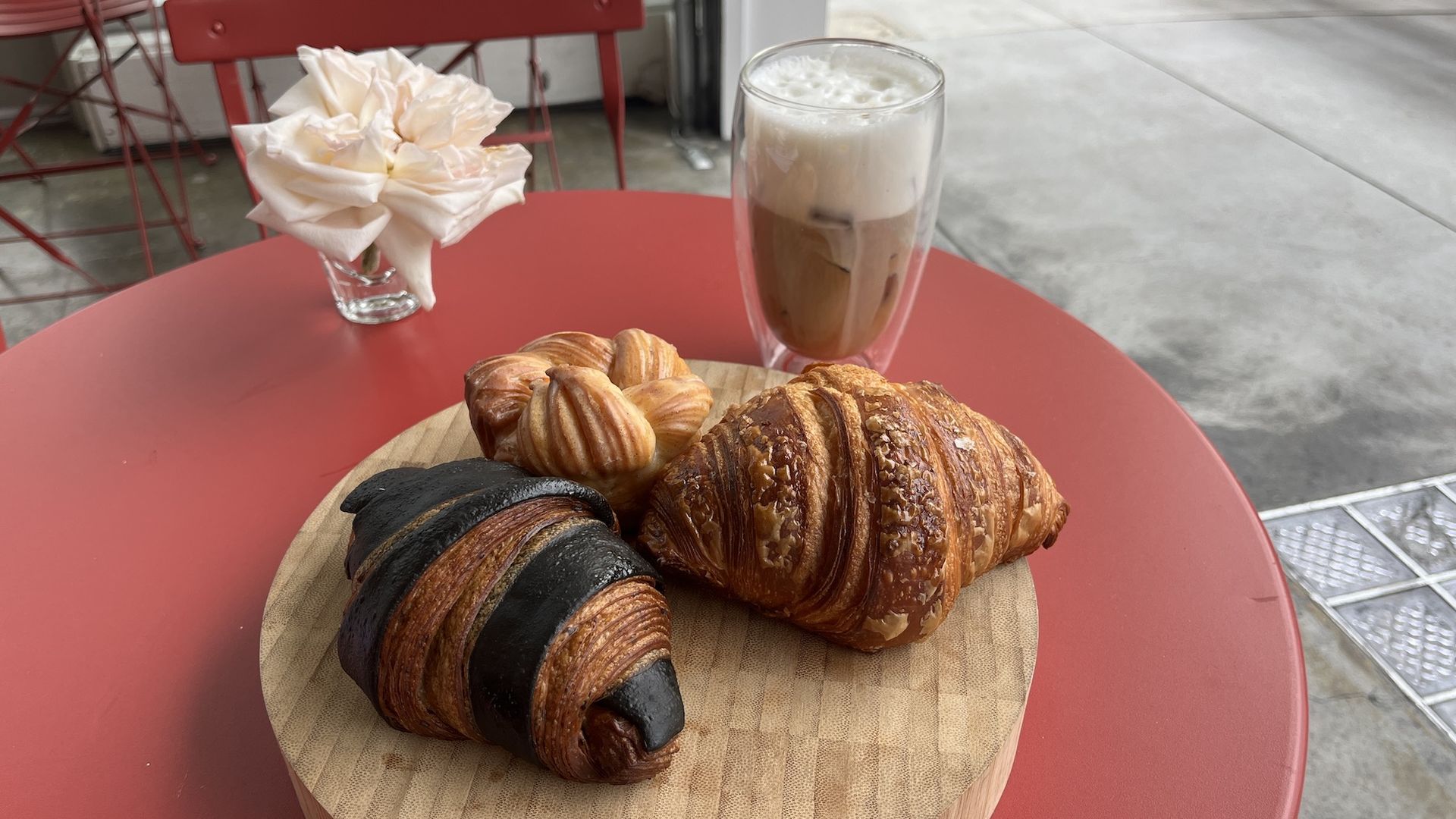 A board of croissants and an iced coffee.