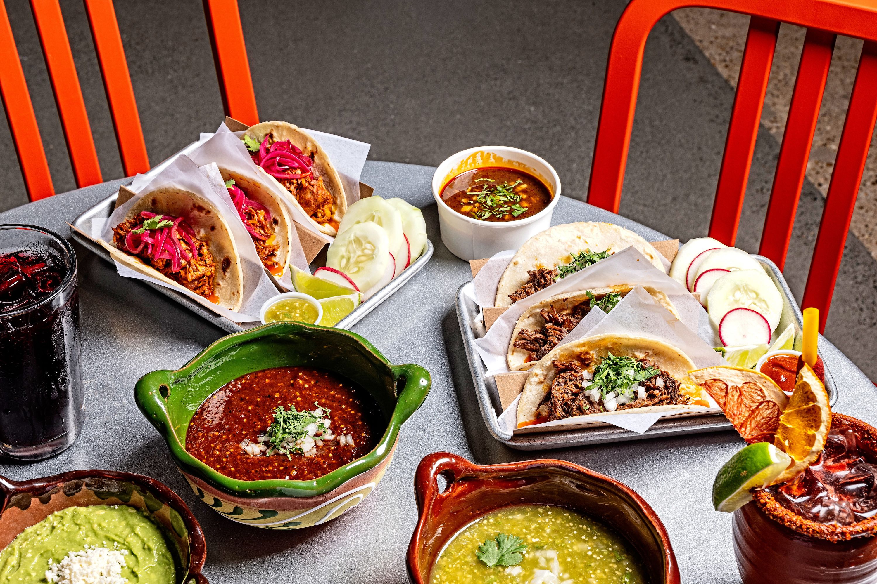 A table with Taqueria Xochi tacos and salsas. Photo courtesy of Scott Suchman/The Square