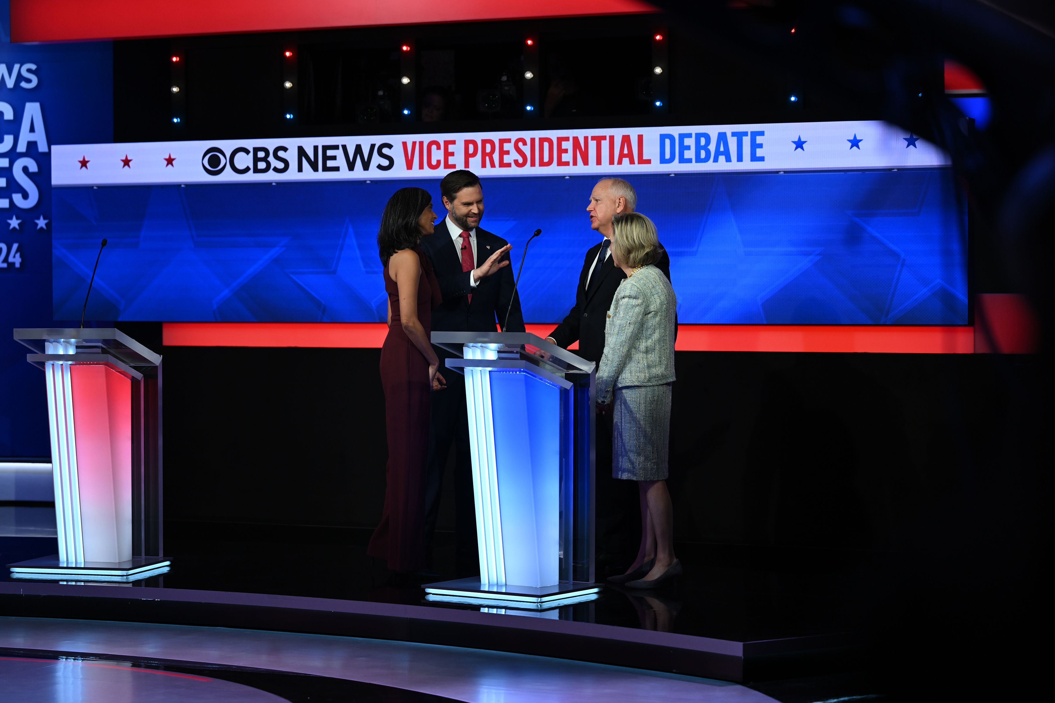 JD Vance and his wife, Usha Vance, greet Tim Walz and Gwen Walz after the debate. Photo: Kenny Holston/The New York Times