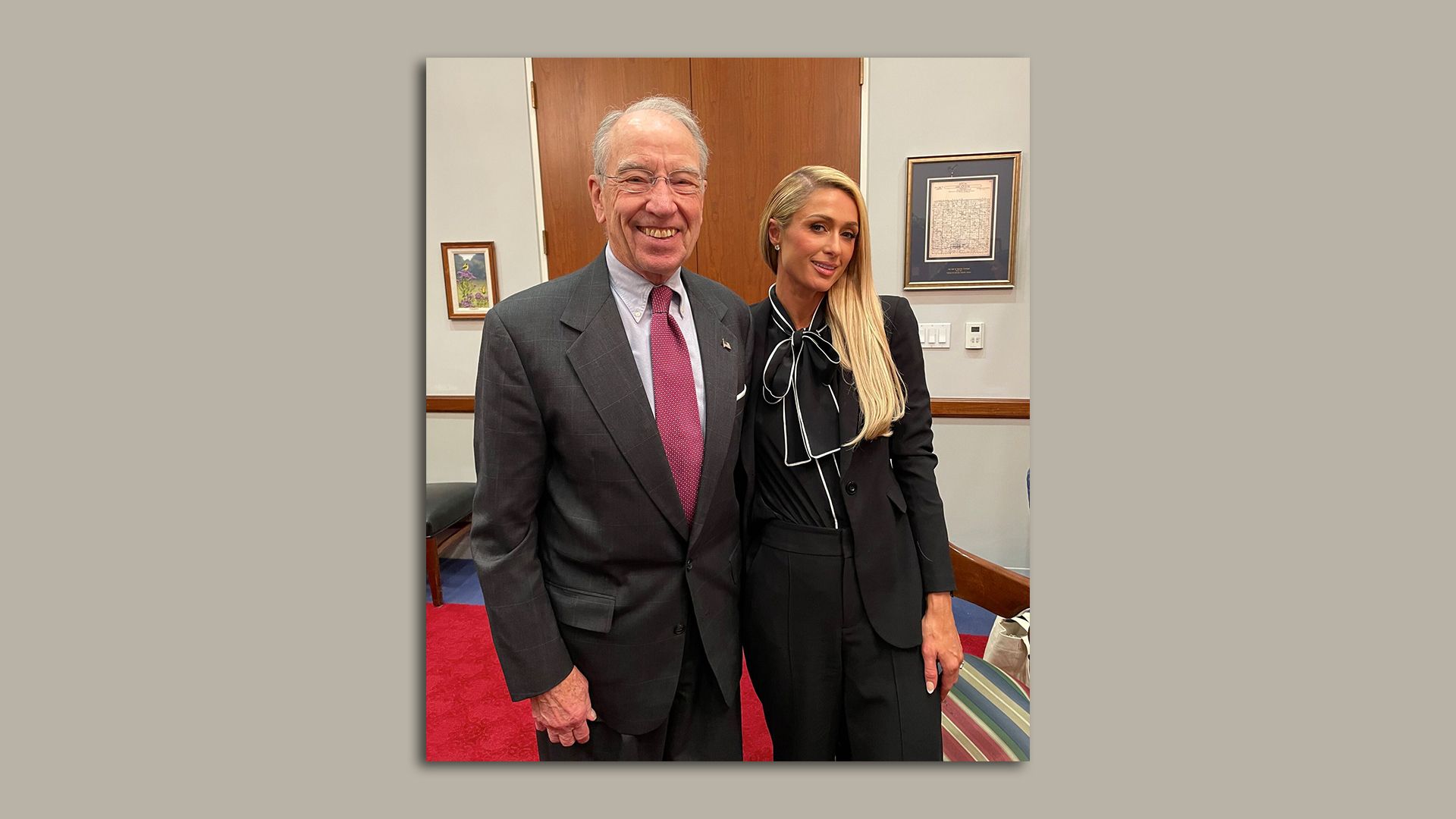 U.S. Sen. Chuck Grassley poses beside Paris Hilton.