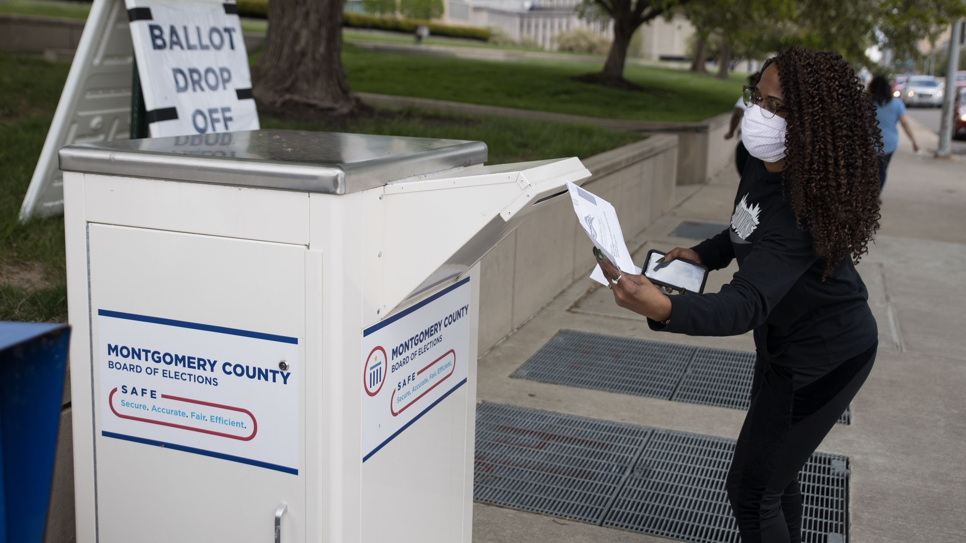 An Ohio voter drops off her ballot at the Board of Elections in Dayton, Ohio on April 28