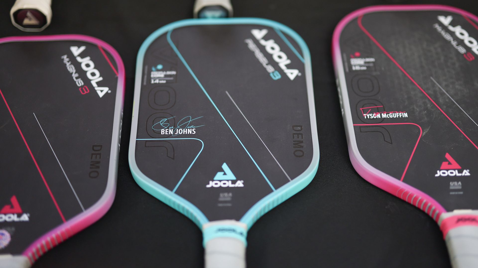 Pickleball paddles on a table.