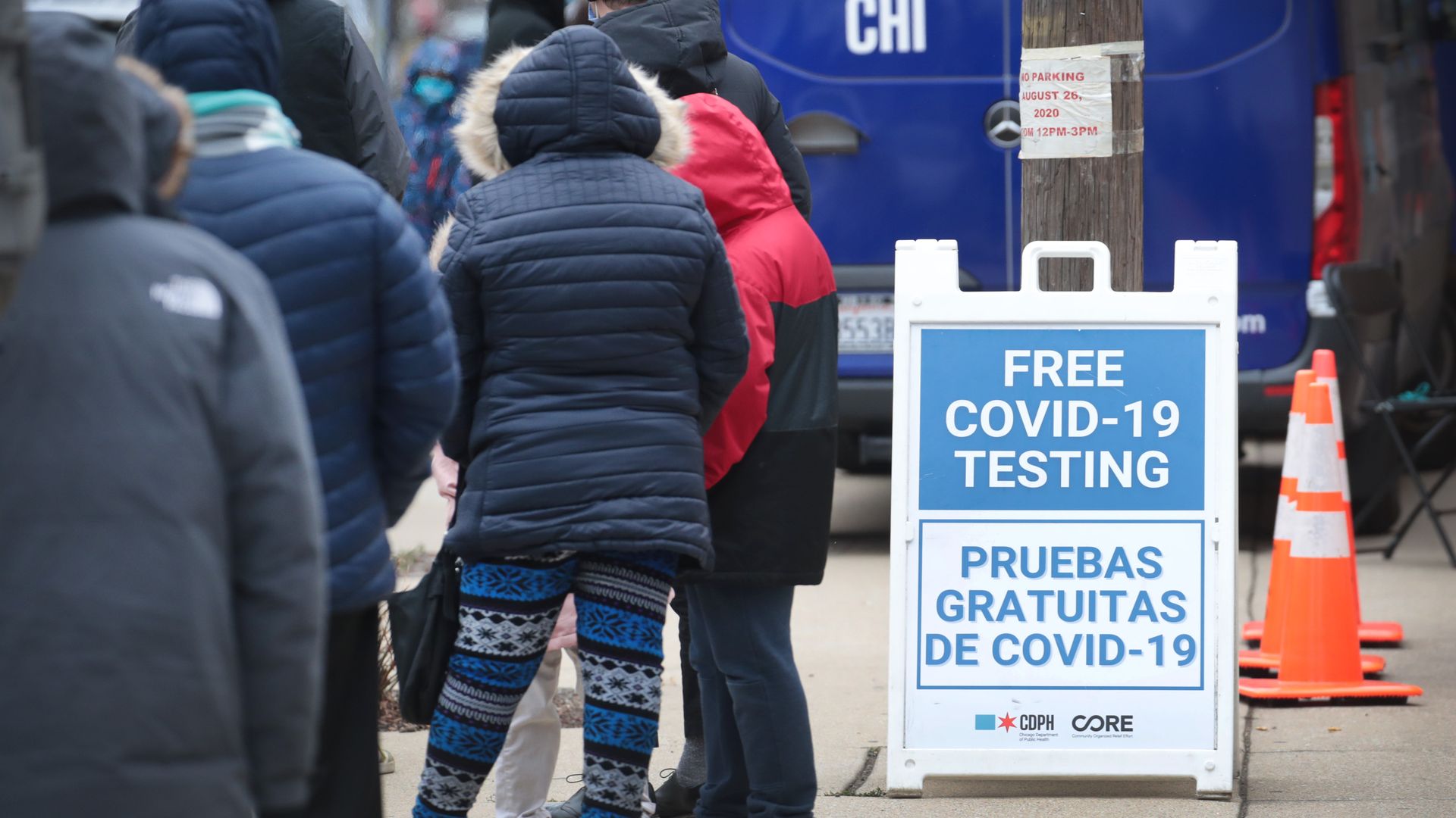 Photo of poeple waiting in line for COVID testing.