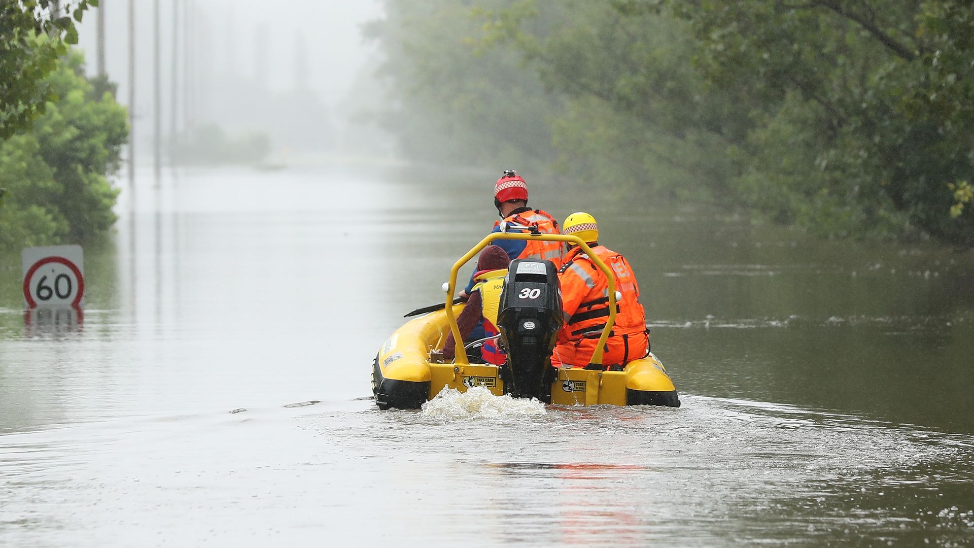  State Emergency Service workers on their rescue craft on the flooded Hawkesbury River in Richmond,  Sydney, on March 23. 