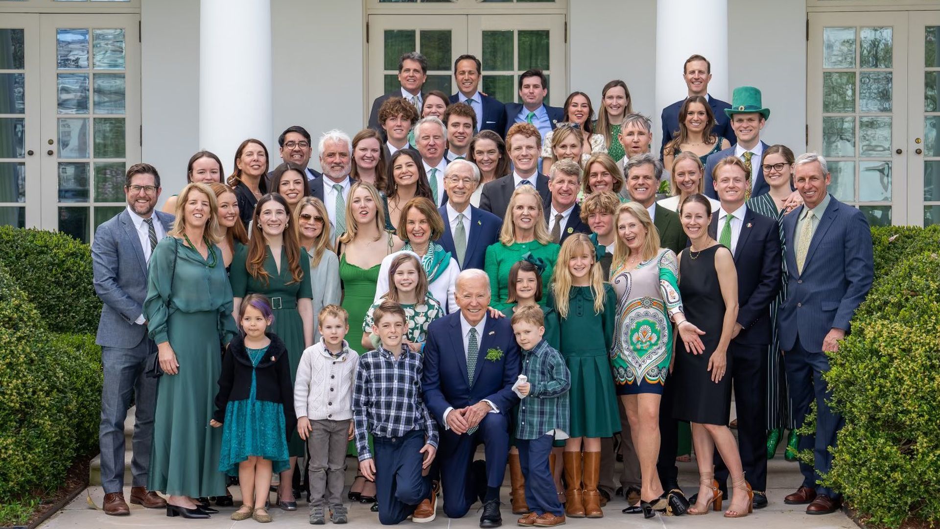 President Biden poses with dozens of Kennedy family members on St. Patrick's Day. 