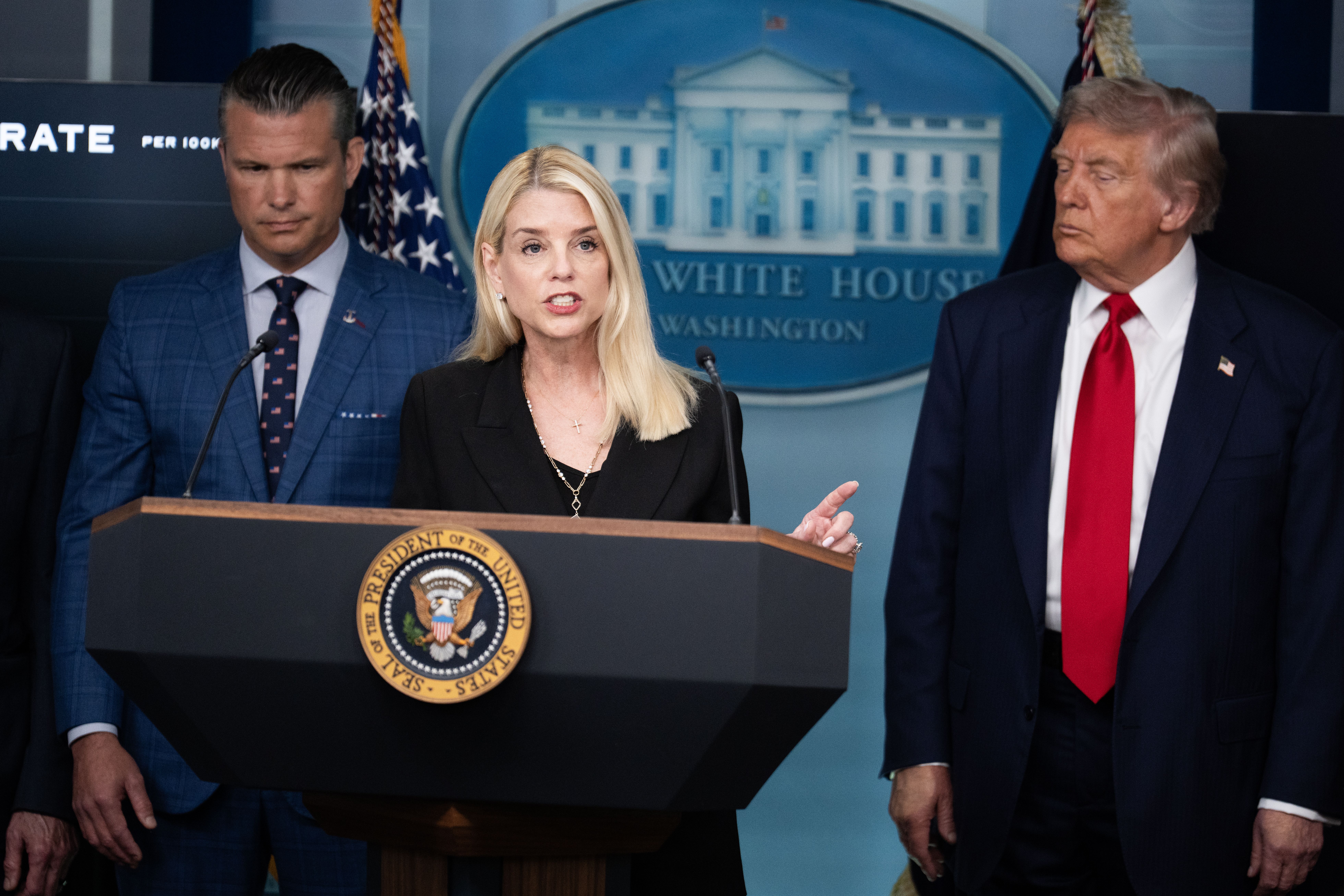Attorney General Pam Bondi, flanked by Defense Secretary Pete Hegseth and President Trump, speaks at last week's White House announcement on D.C. policing. Photo: Tom Williams/CQ Roll Call via Getty Images 