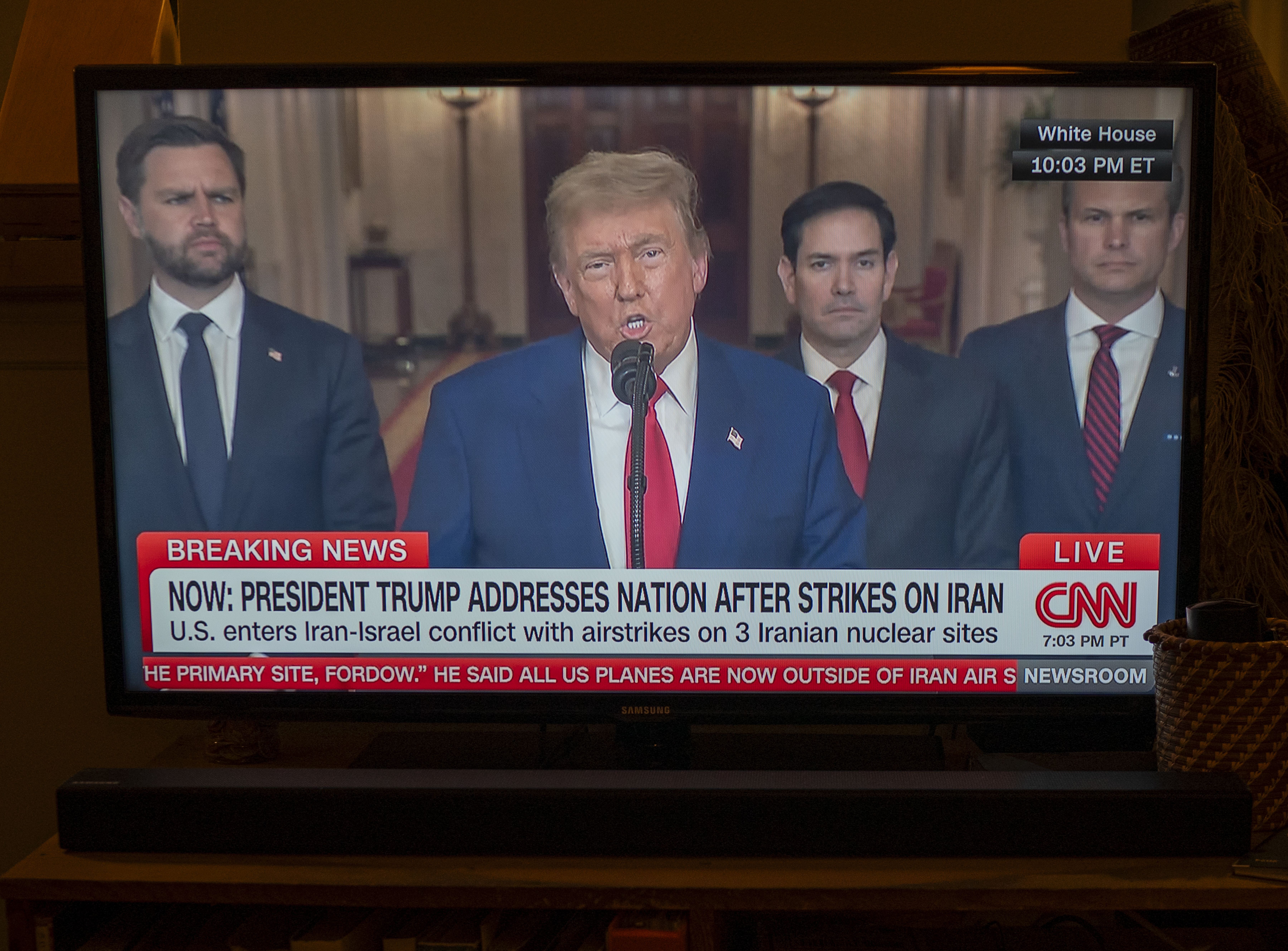 President Donald Trump speaks from the East Room of the White House as Vice President JD Vance, Secretary of State Marco Rubio and Defense Secretary Pete Hegseth stand beside him during a televised address about U.S. strikes on Iran.
