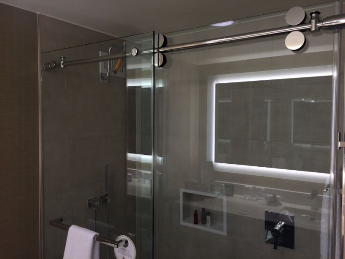 Glass shower door > shower curtain