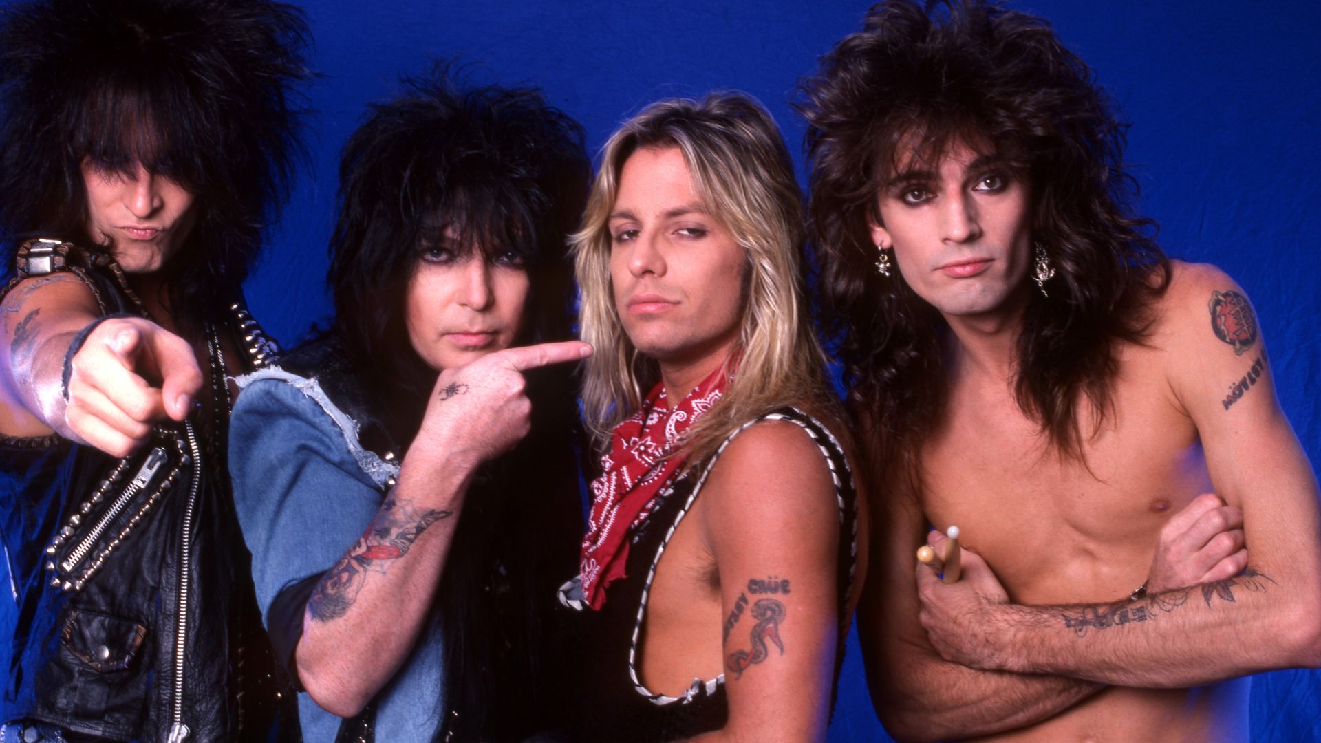 The members of Motley Crue pose for a picture.