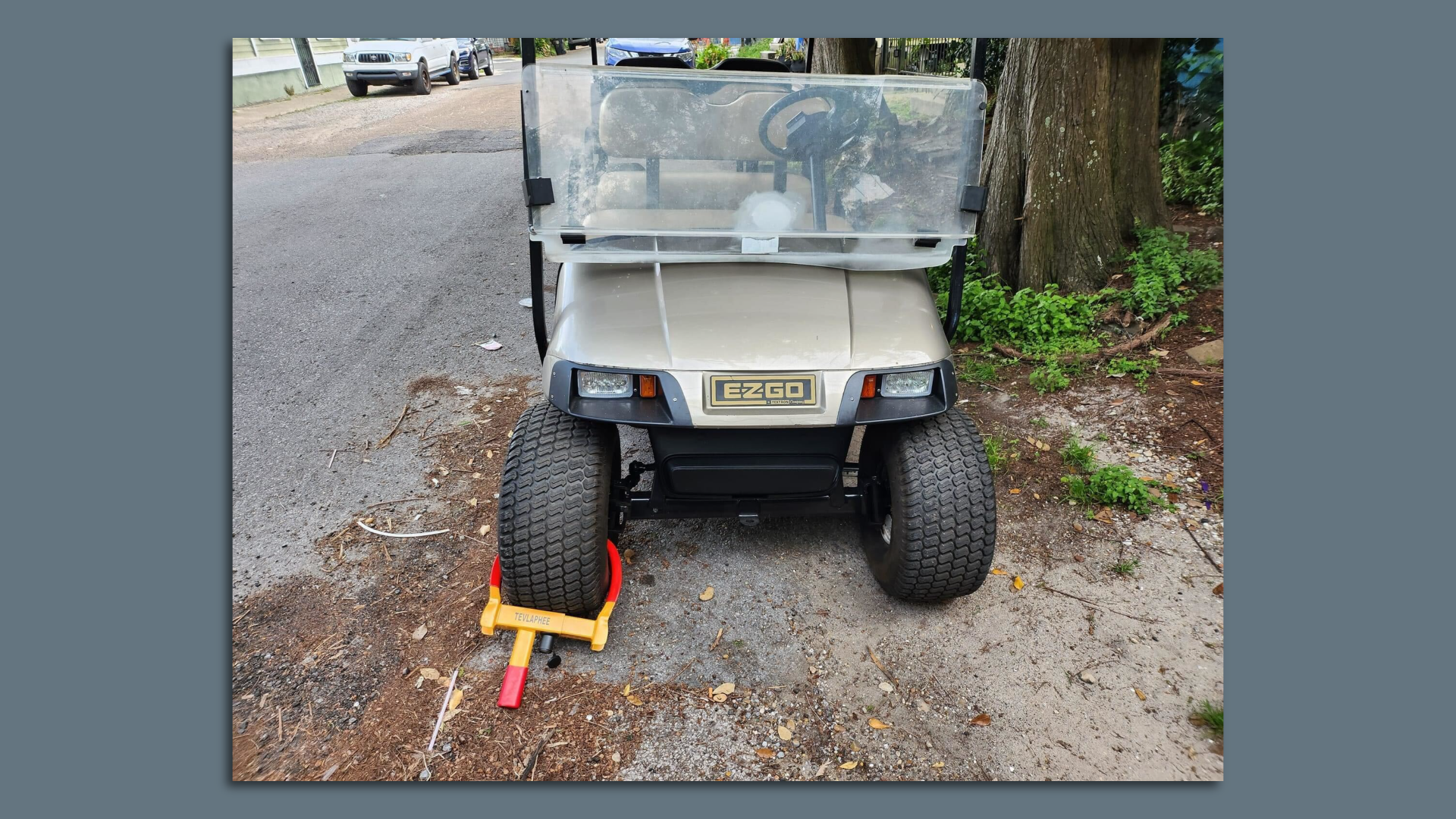 Photo shows a golf cart with a boot on it.