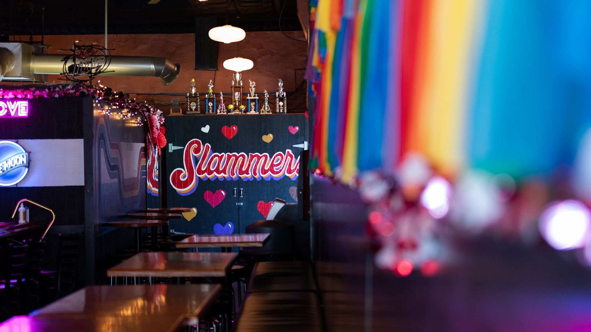 A mural reading "Slammers" surrounded by hearts, with a rainbow wall