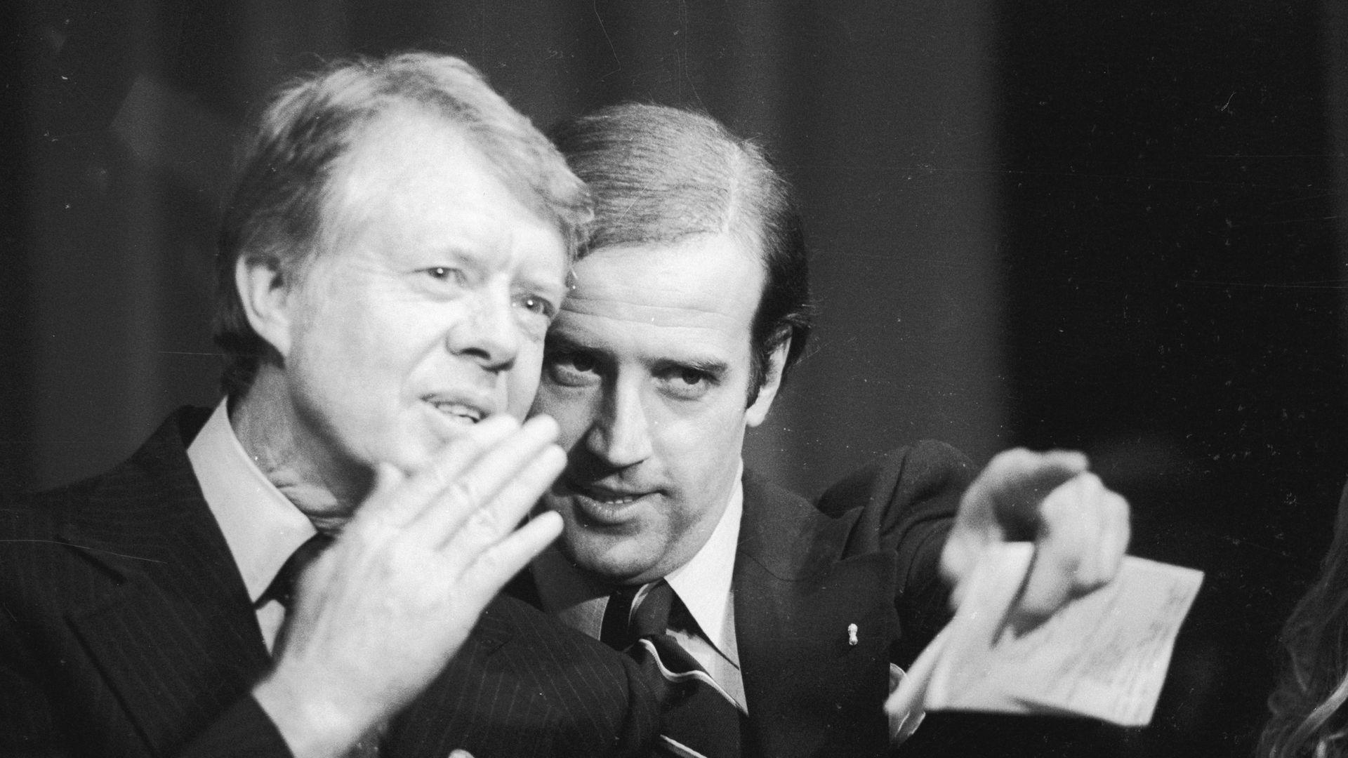 Jimmy Carter whispers to Joe Biden