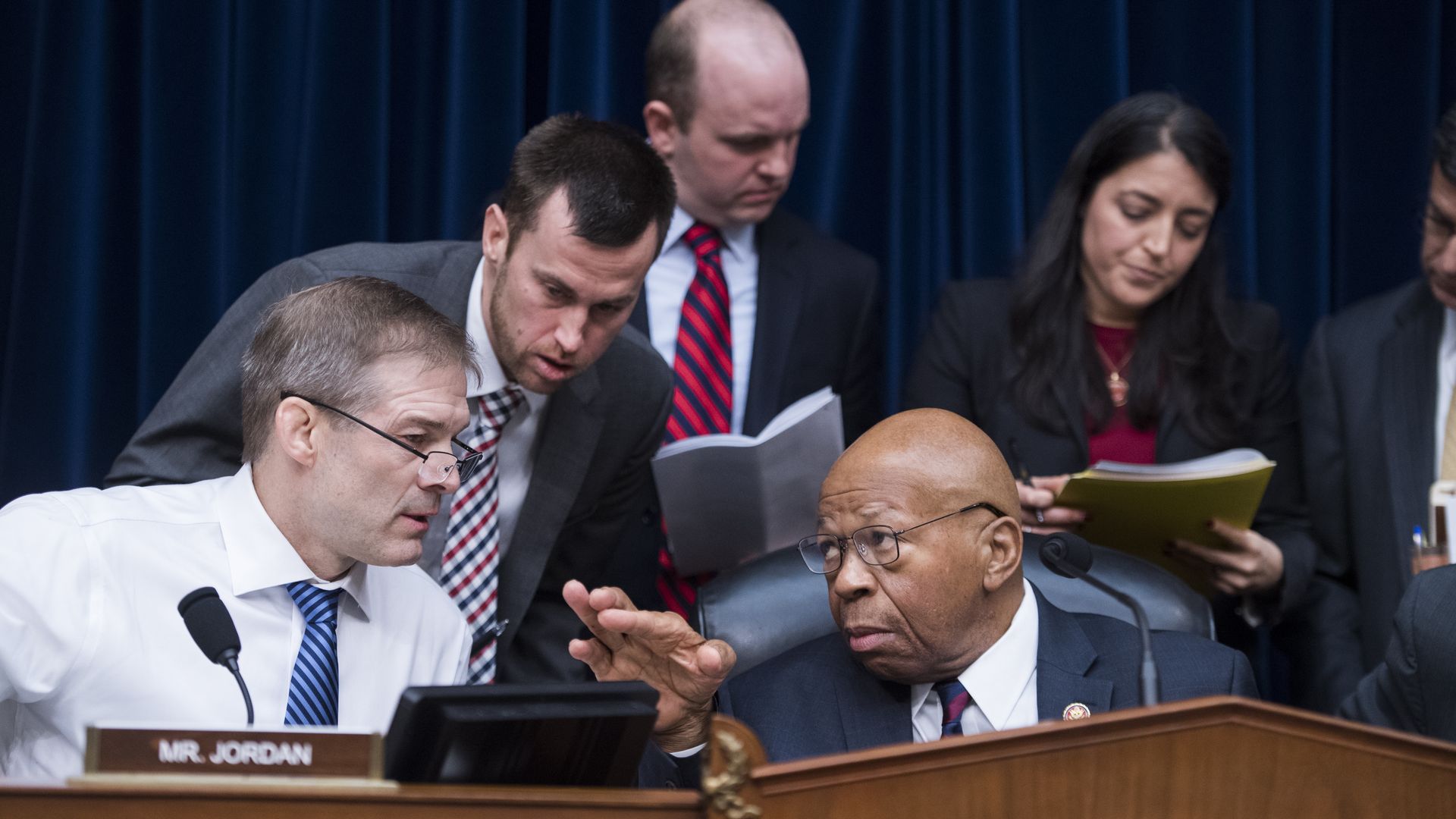 Reps. Elijah Cummings and Jim Jordan confer during a hearing
