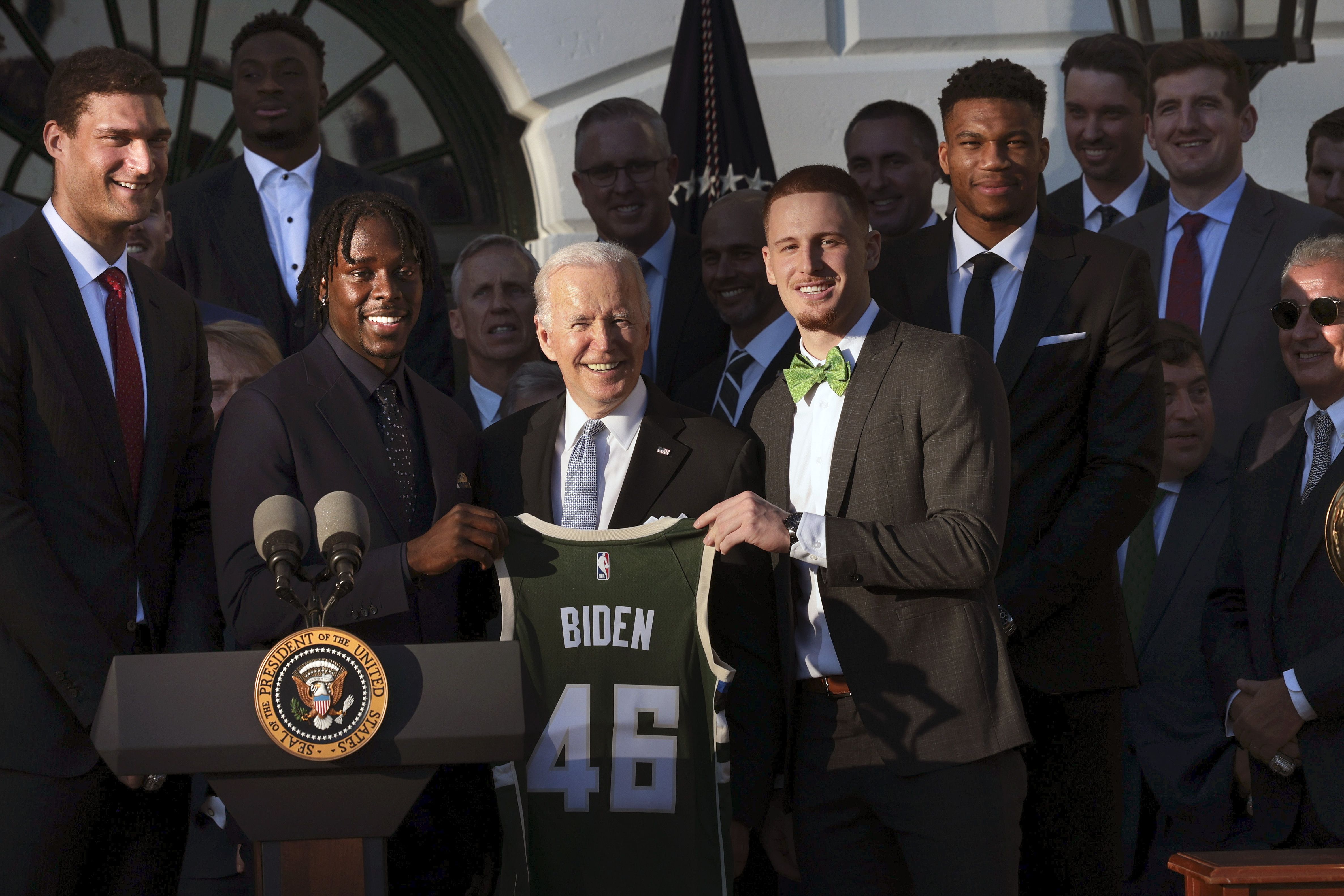 President Biden posing with his Bucks jersey