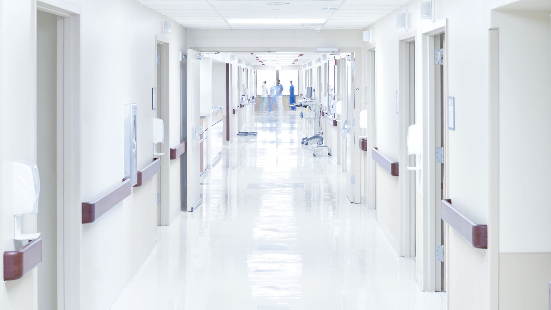 A long white hospital hallway. 