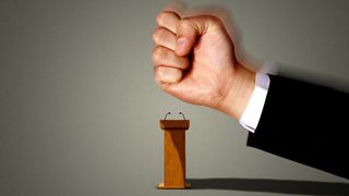Illustration of a large fist coming down on a small podium about to smash it. 