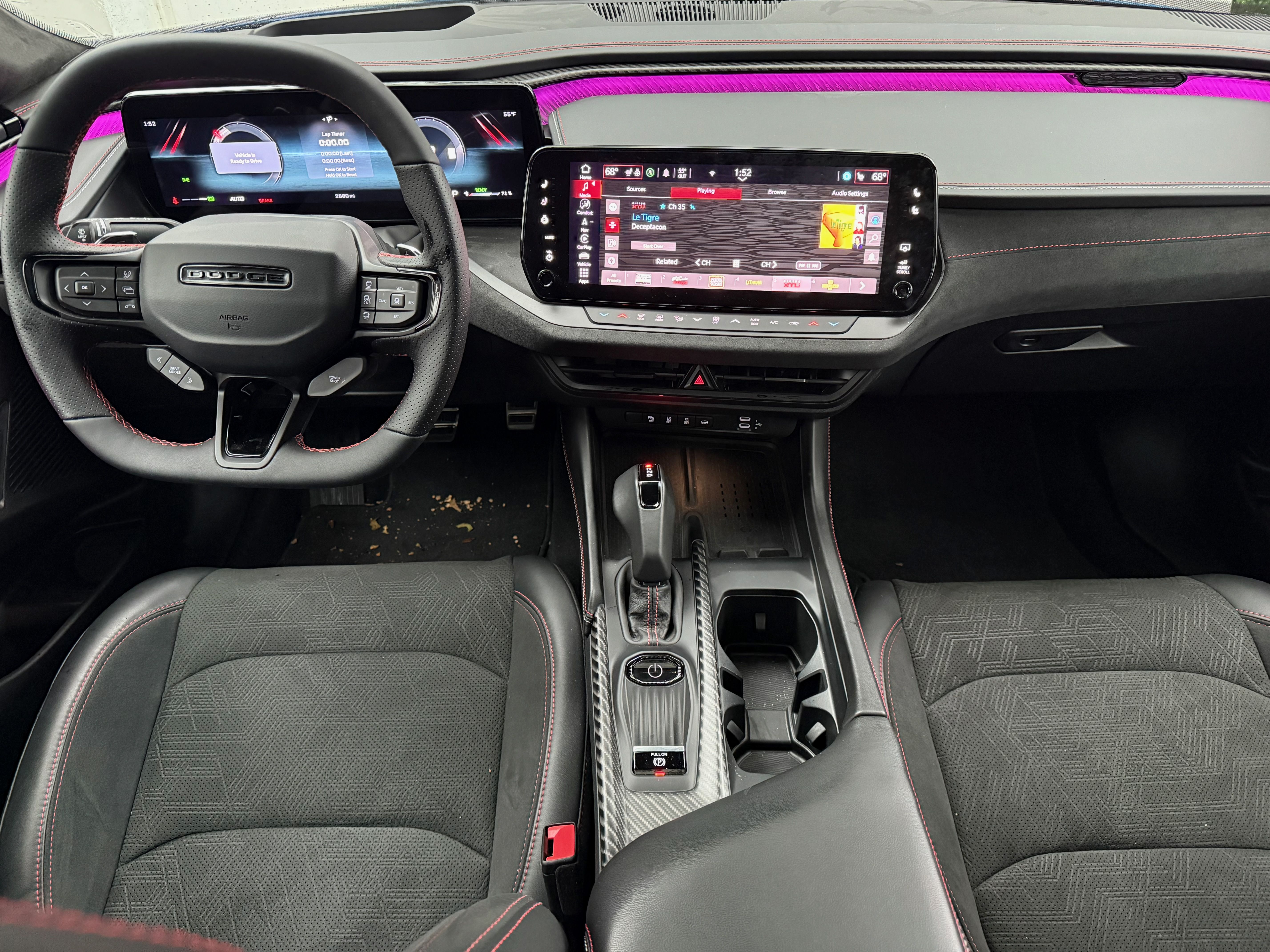 A photo of the black-trimmed front seats of a Dodge Charger EV