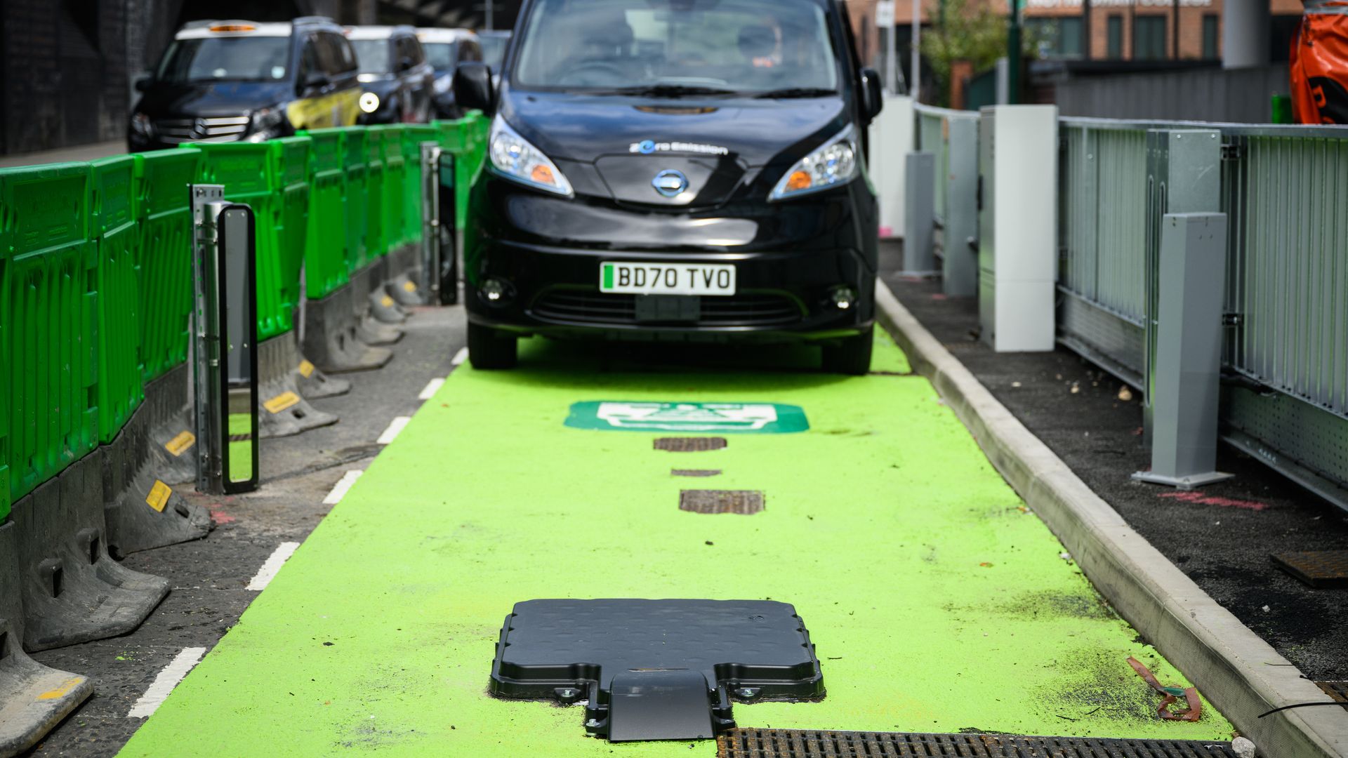  A taxi fitted with prototype charging hardware is seen parked in taxi rank that features wireless electric charging pads on August 18, 2022 in Nottingham, England. 