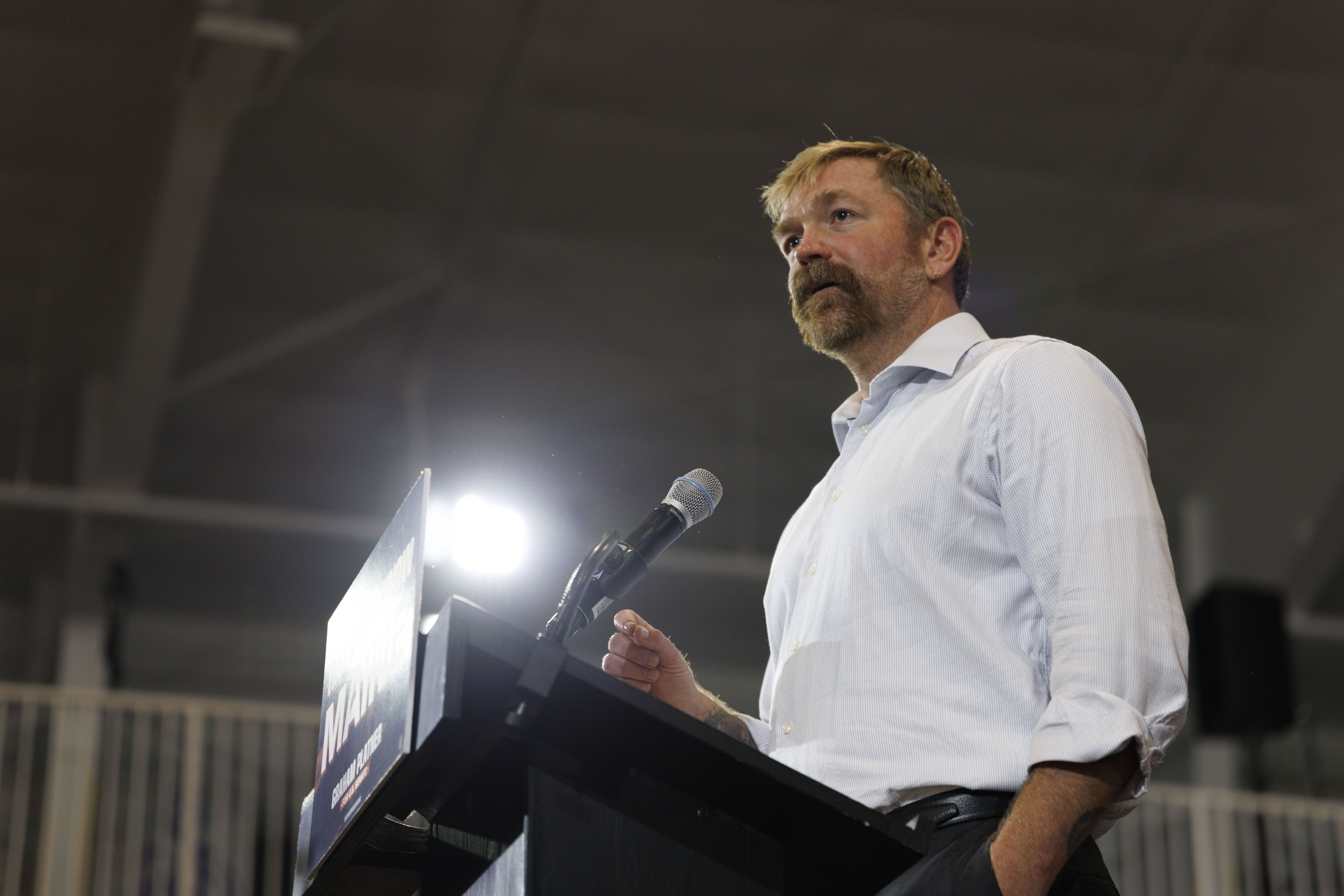 Democratic U.S. Senate candidate Graham Platner speaks at a podium during his primary election night event in Blue Hill, Maine, after winning the Democratic nomination.
