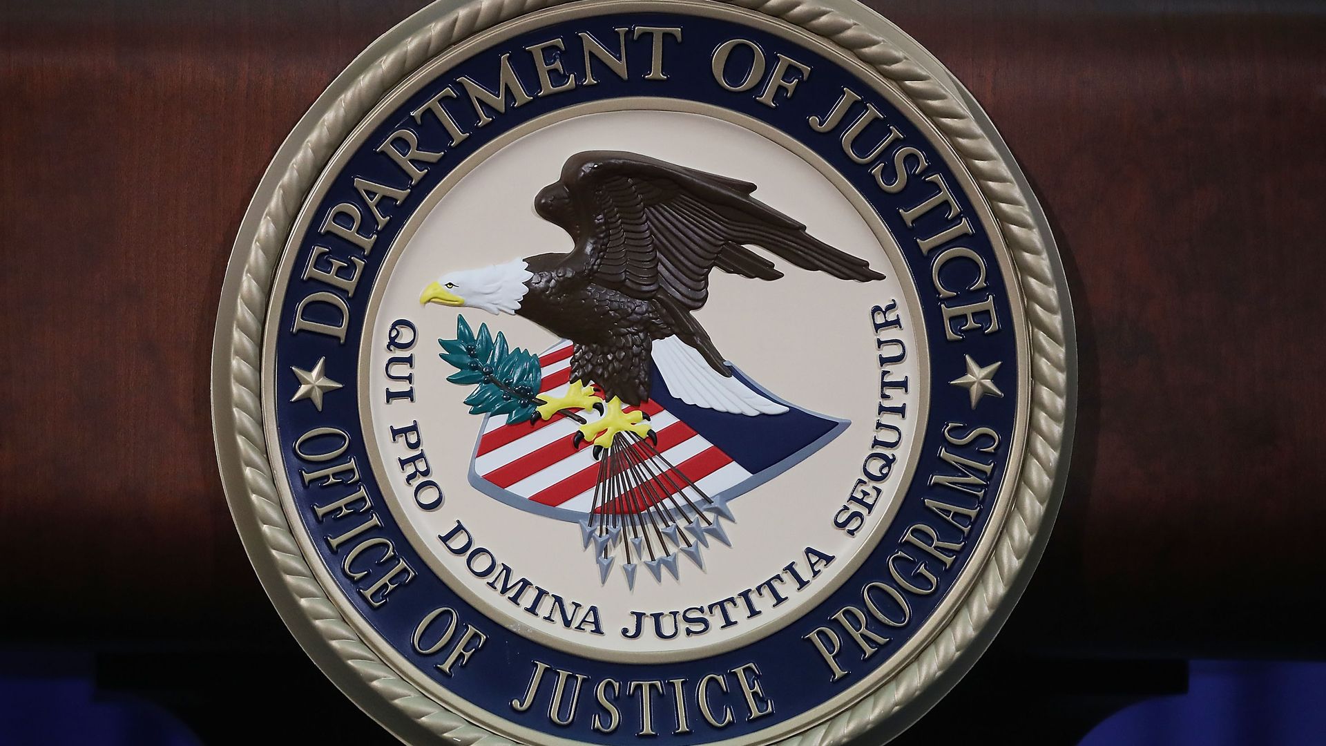 The Justice Department seal is seen on the lectern during a Hate Crimes Subcommittee summit on June 29, 2017.