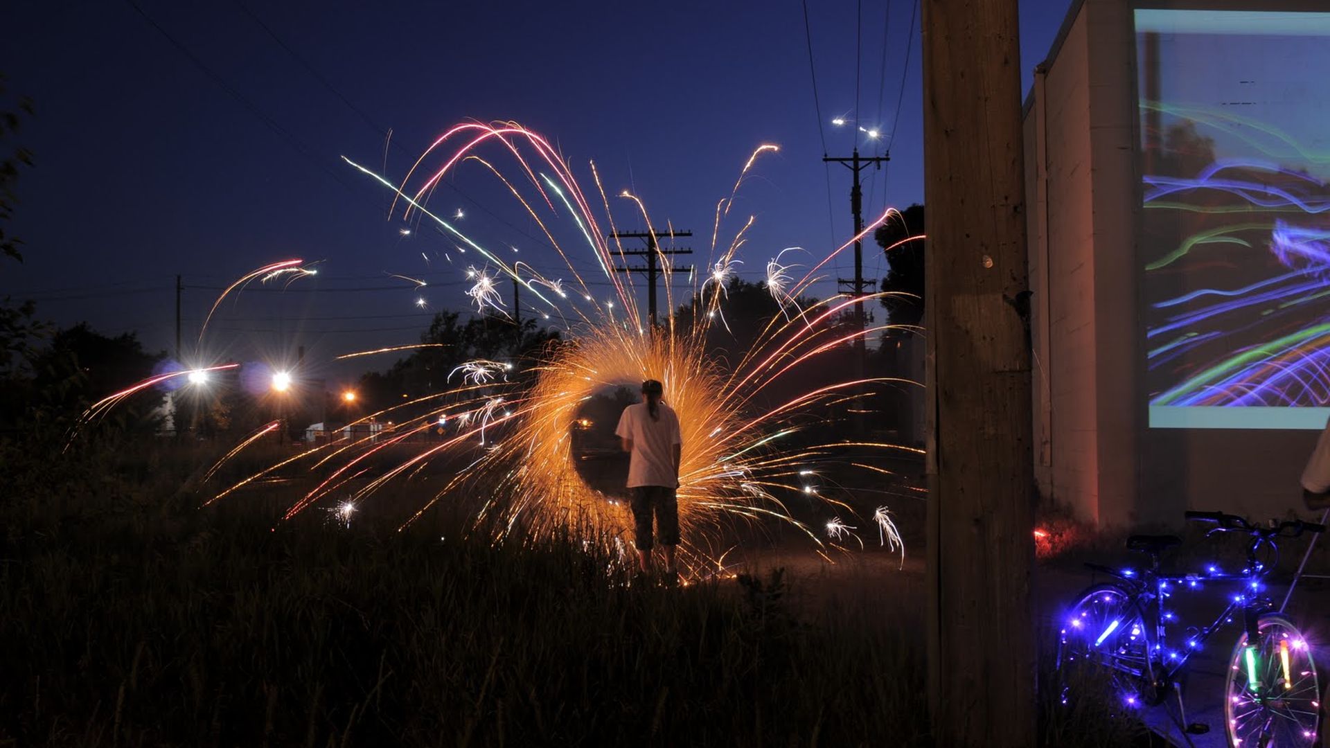 A person surrounded by spinning fire.