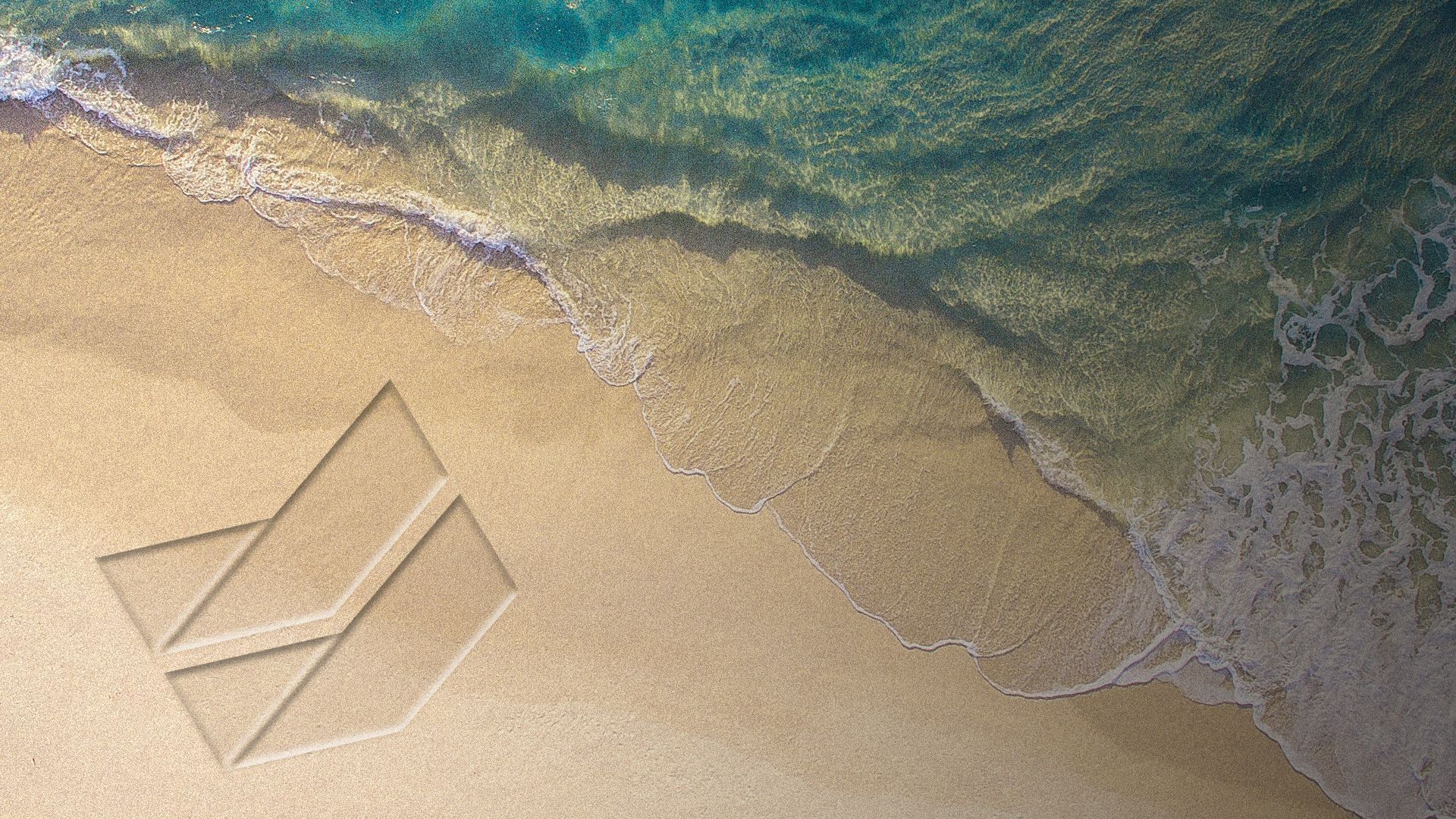 Illustration of the Chevron logo drawn in the sand.