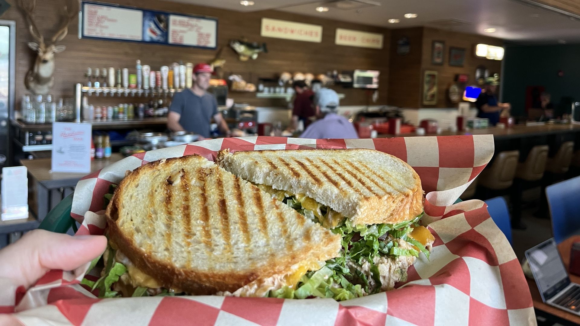 a photo of a sandwich on a checkered paper
