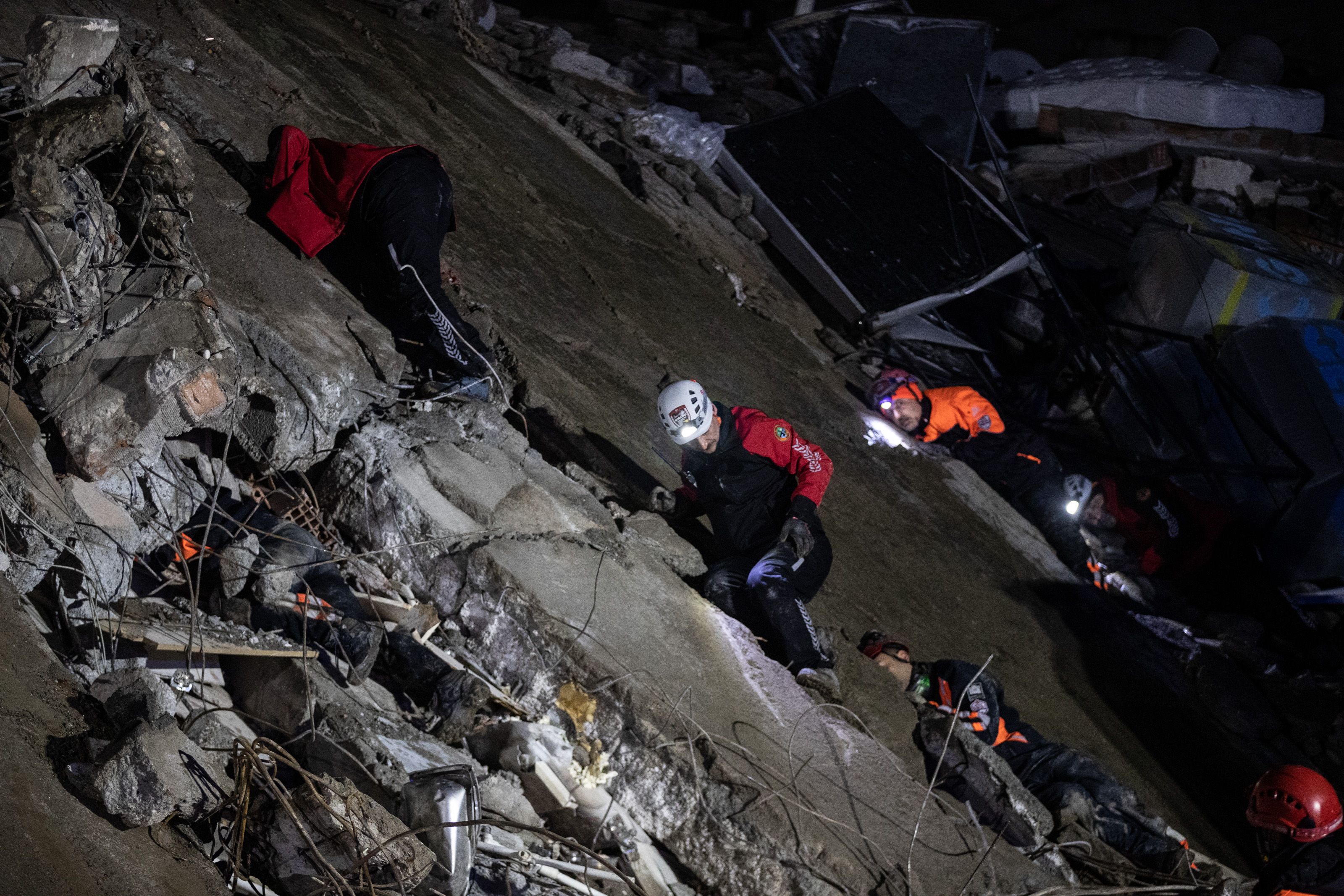 Rescue workers attend the scene of a collapsed building on February 06, 2023 in Iskenderun Turkey. 