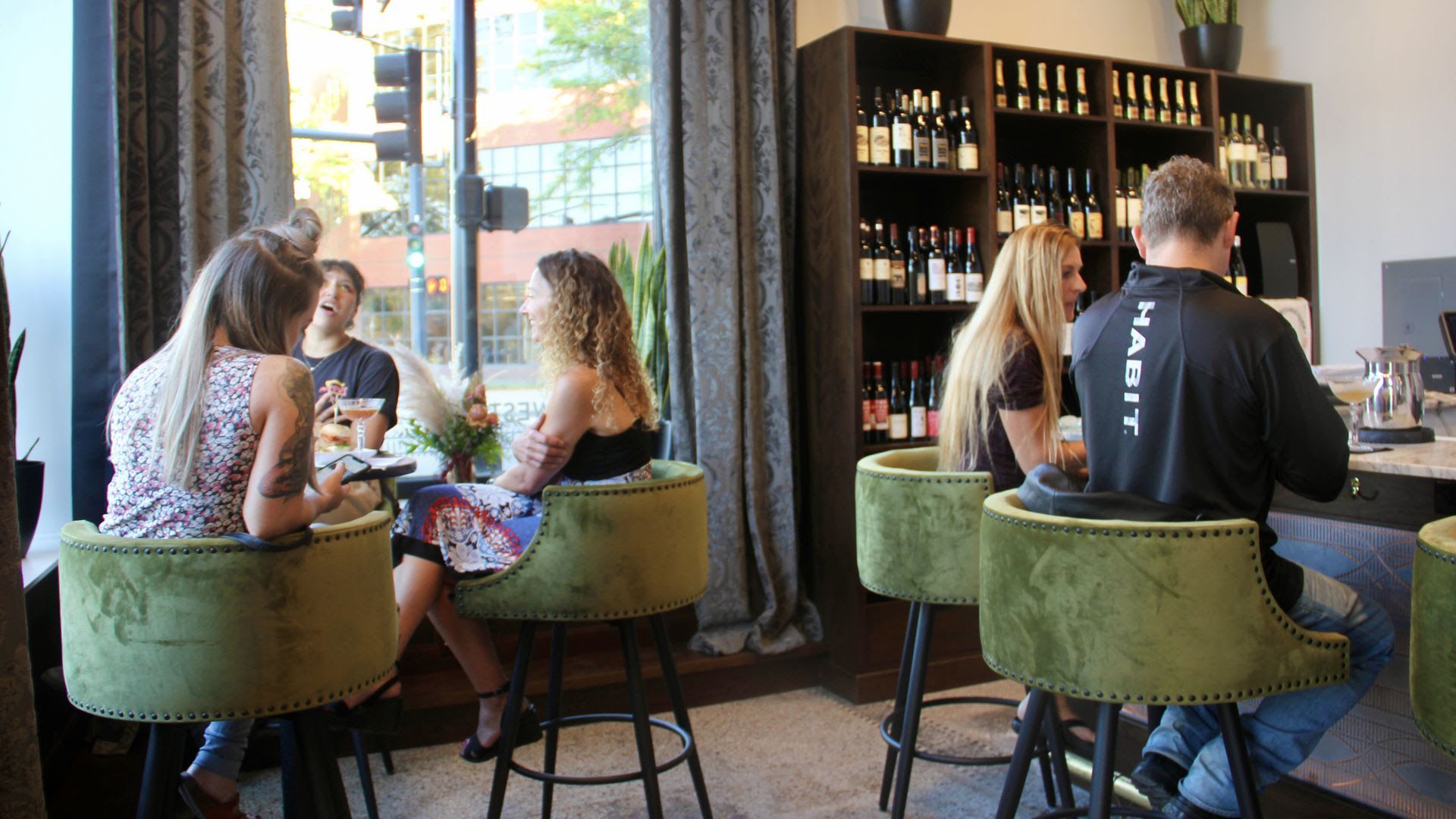 Two groups of people dine inside Des Moines' New Northwestern.