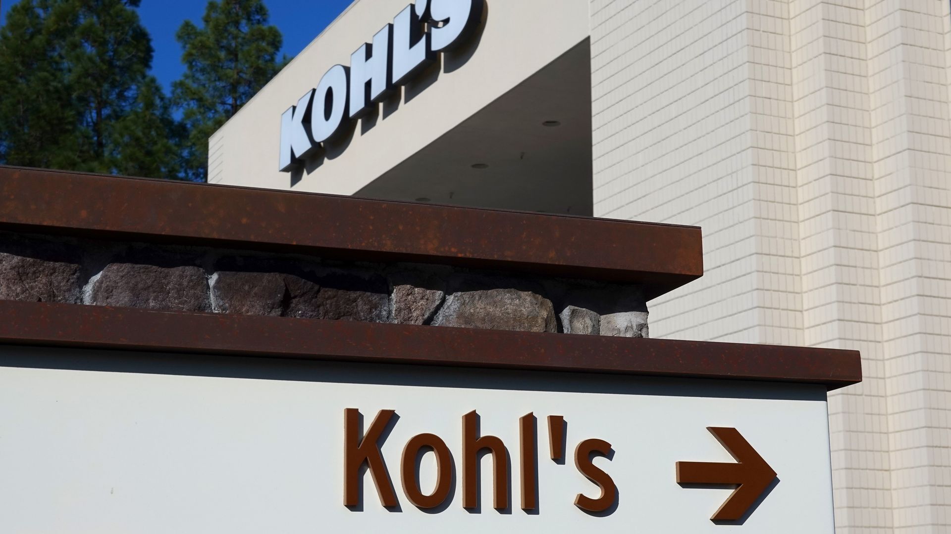 The Kohl's logo, spelled out in white lettering, is displayed above an entrance to one of its stores.