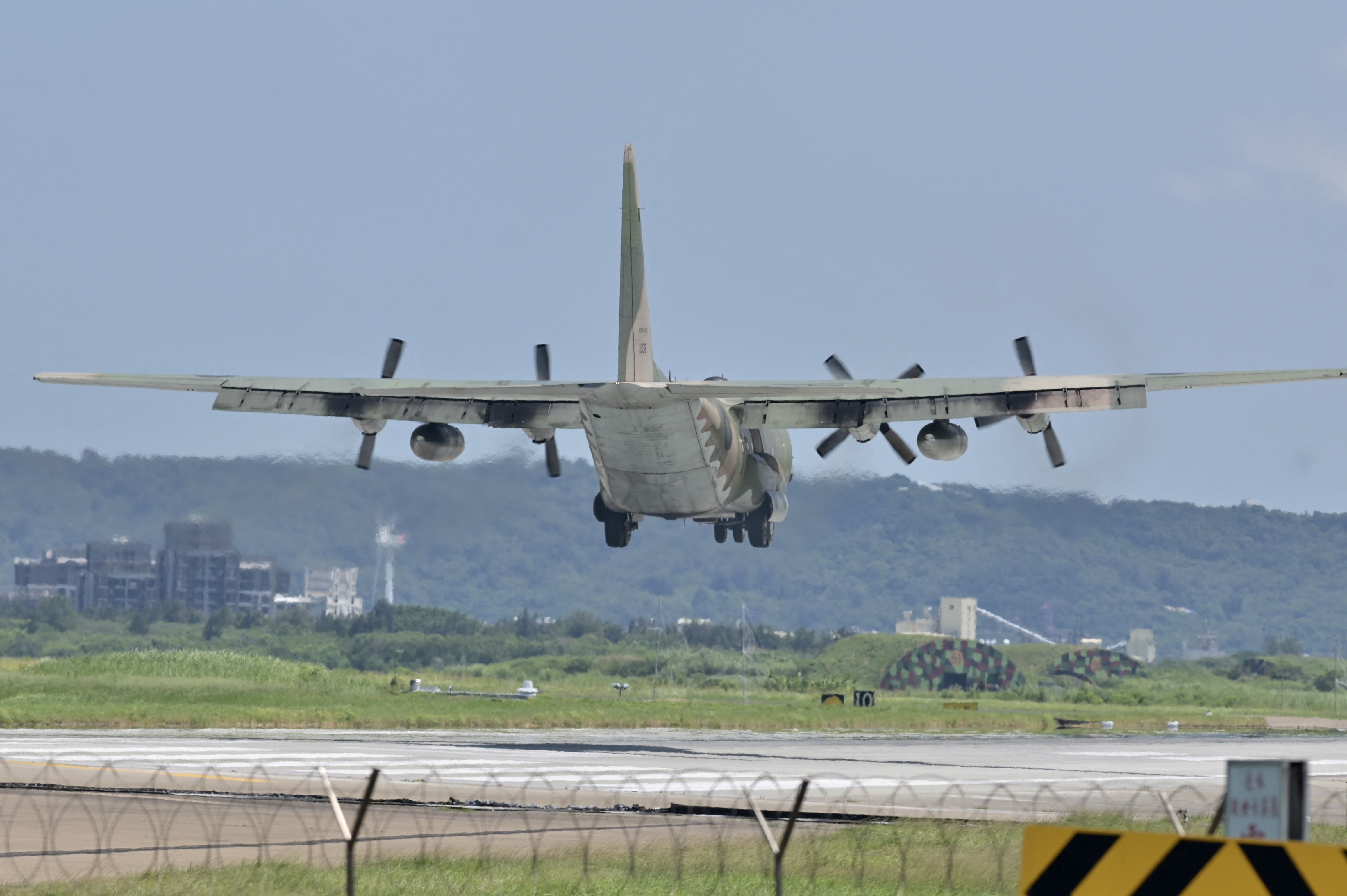 A US-made C-130 aircraft prepares to land on a runway at the Hsinchu Air Base in Hsinchu on August 5.