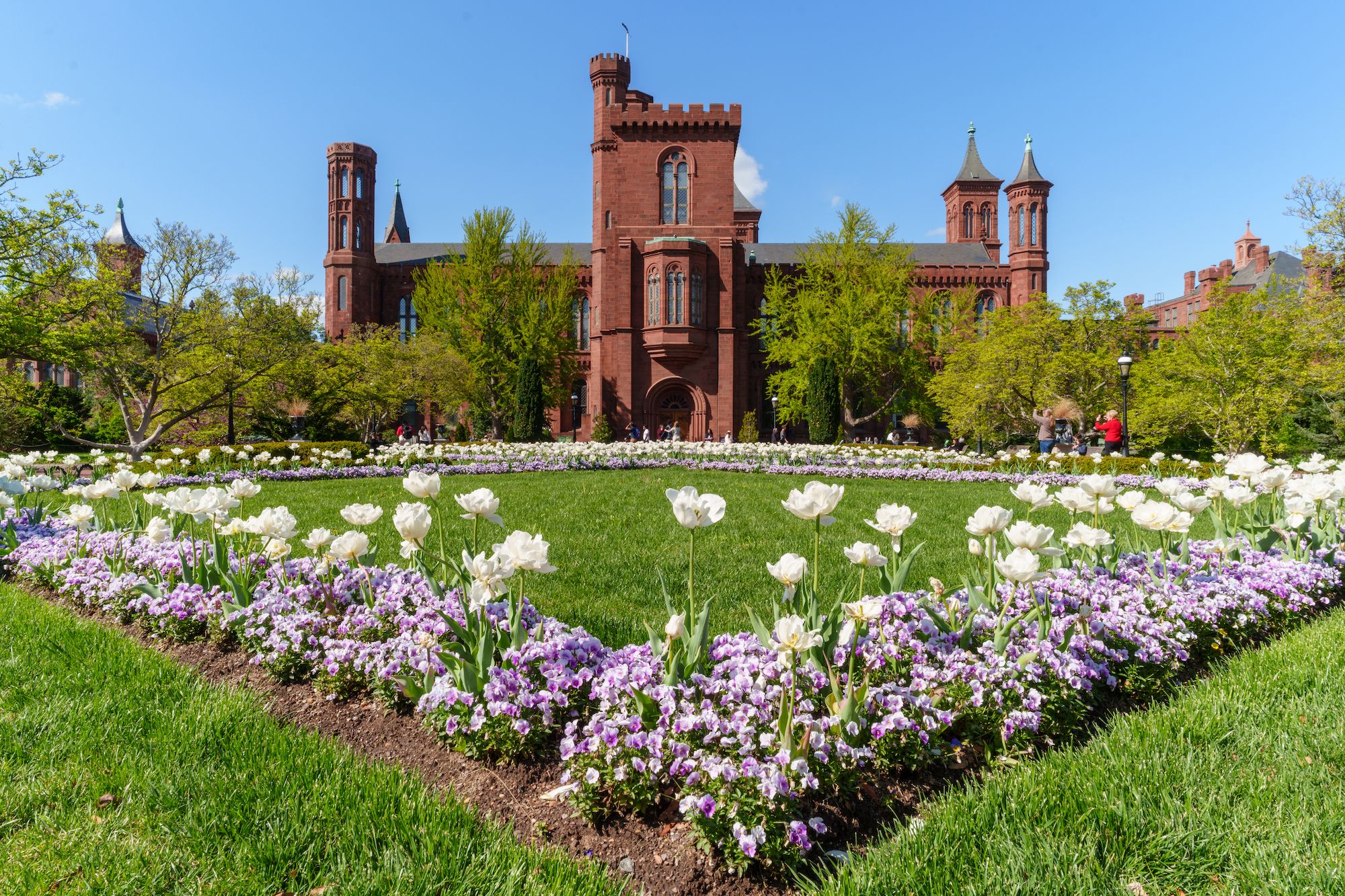  The Enid A. Haupt Garden leads to the entrance of the Smithsonian Institution Building, also known as the Smithsonian Castle, on April 13, 2025, in Washington, DC. The building houses the main administrative offices of the Smithsonian Institution. (Photo by J. David Ake/Getty Images)