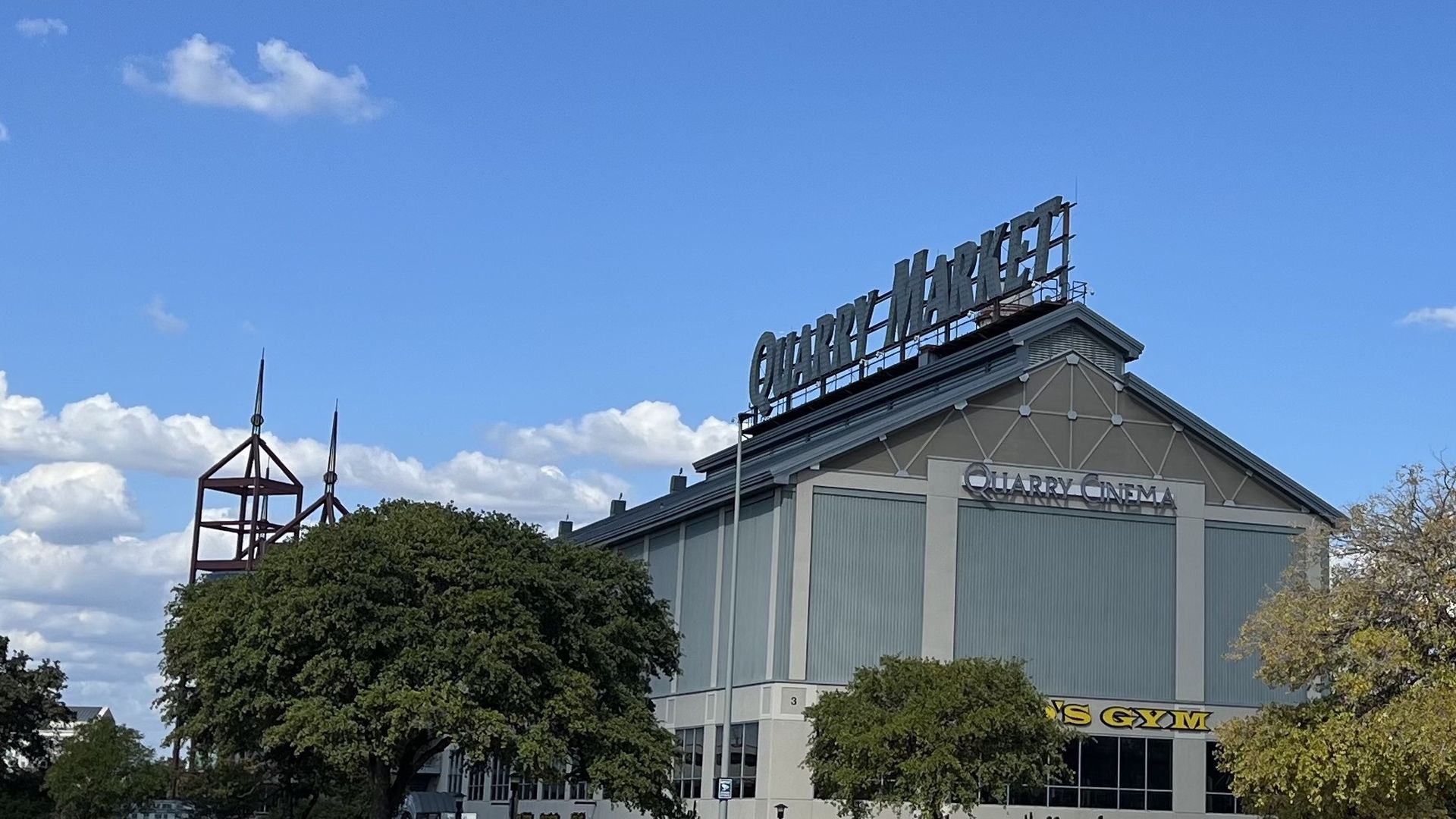 A multi-floor building with large signage that says "Quarry Market."