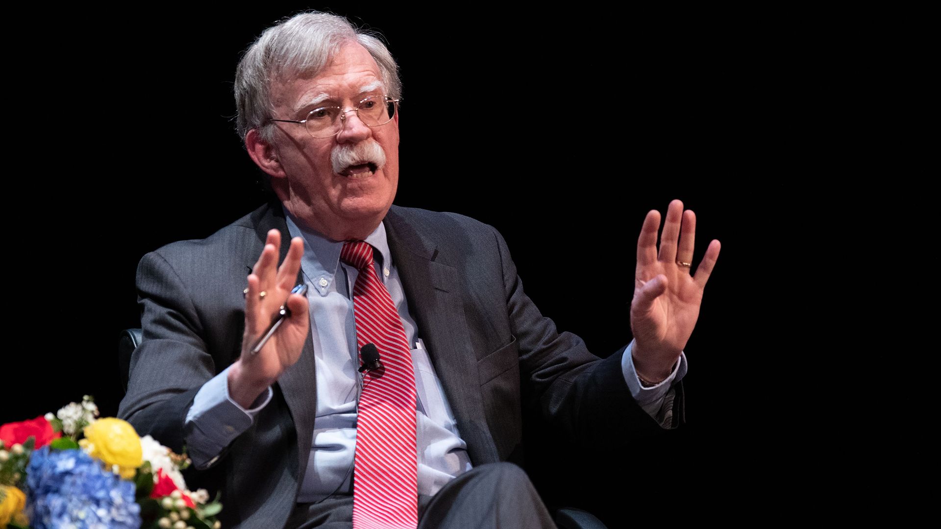 Bolton sits next to flowers