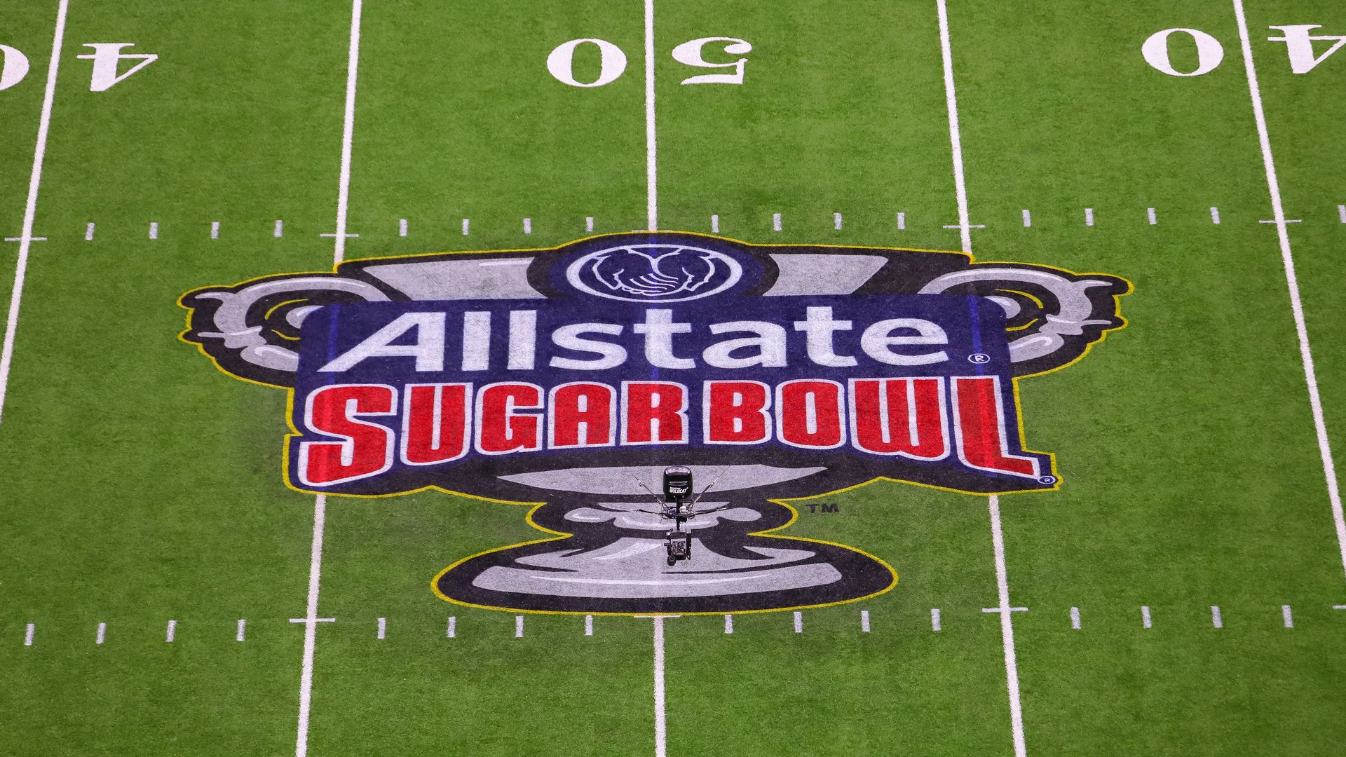 Photo shows the Allstate Sugar Bowl logo on the field of the Superdome.