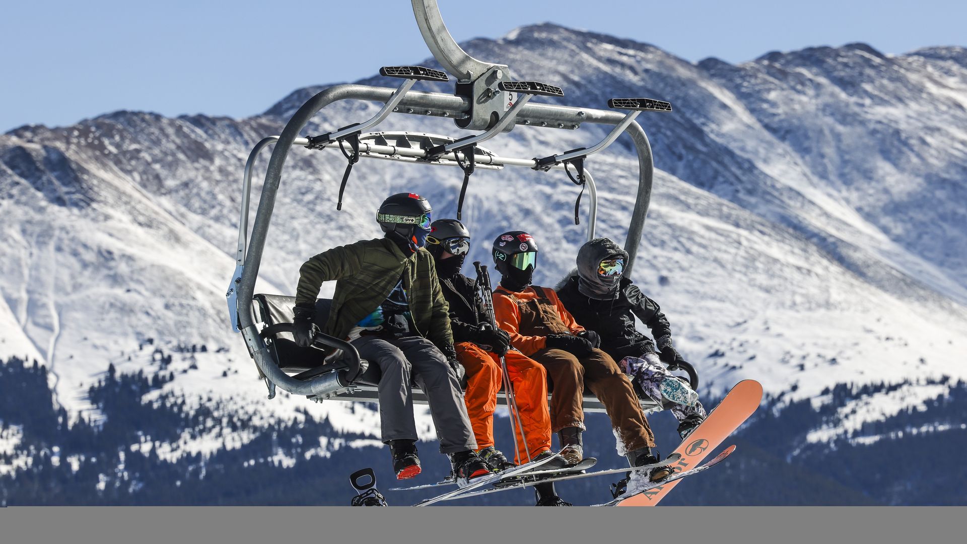 People ride up the chair lift at Breckenridge ski resort in 2020. 