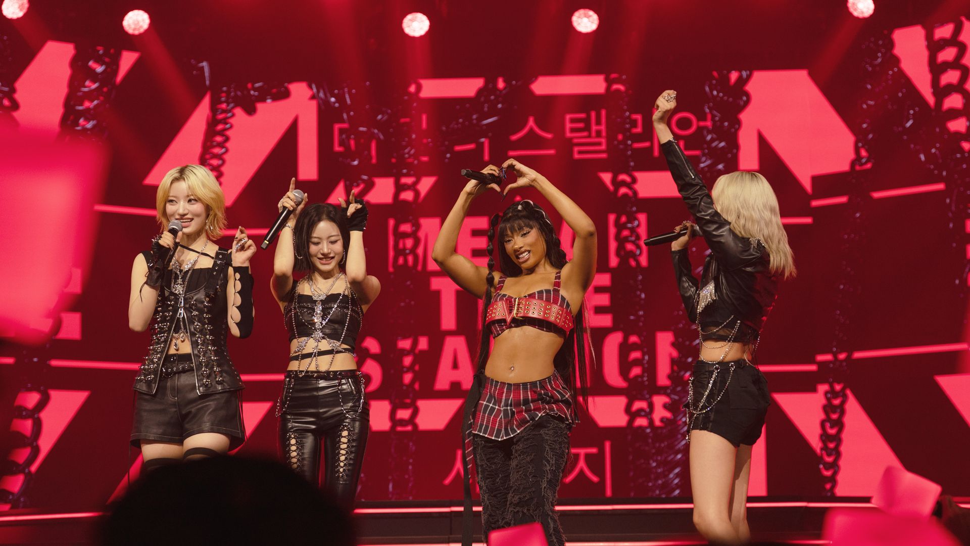 Megan Thee Stallion and members of BILLLIE performing in "KPOPPED," premiering globally on August 29, 2025 on Apple TV+.