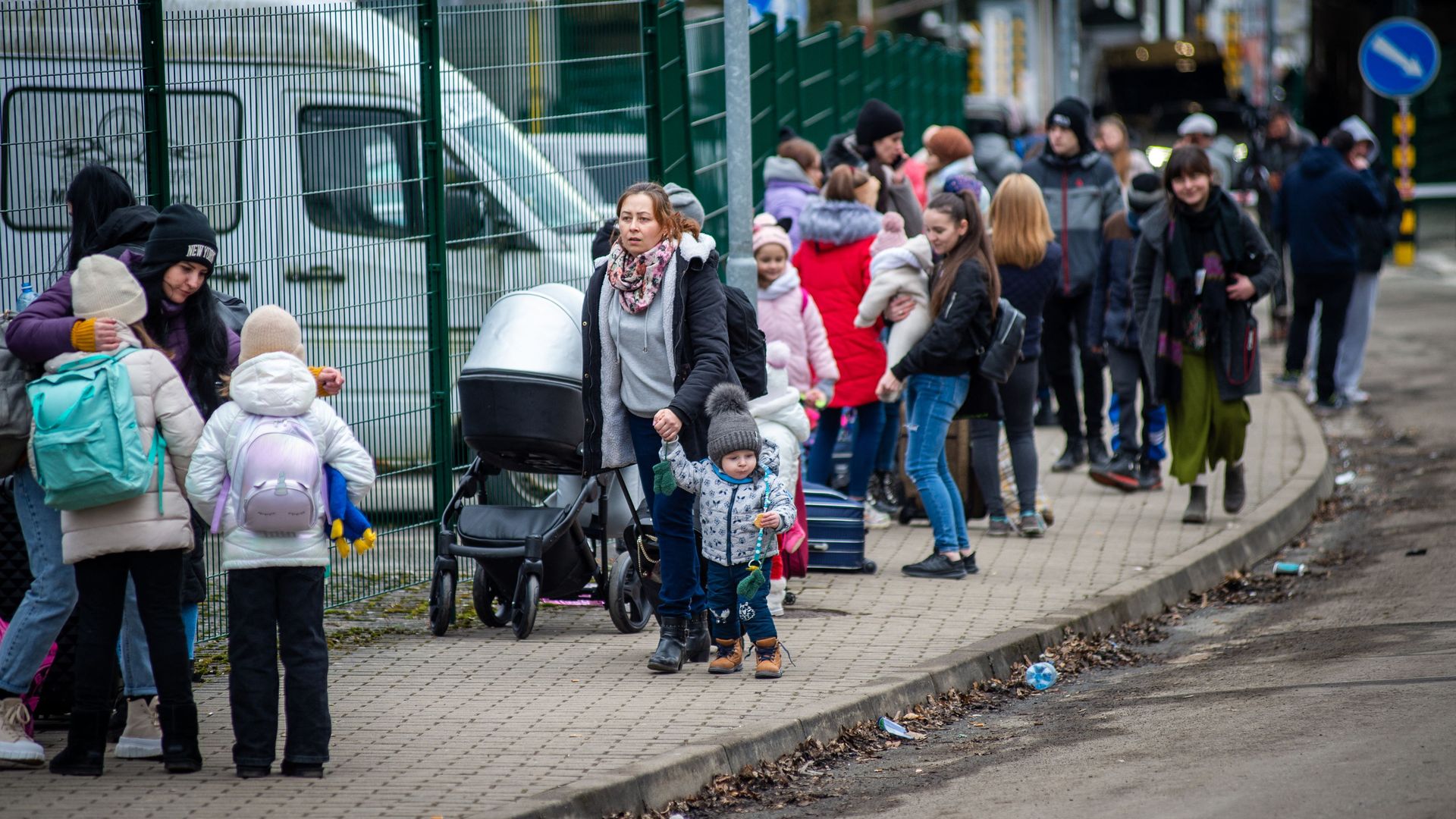 Ukrainian women and children are seen after crossing the Slovak-Ukrainian border to leave Ukraine in Ubla, eastern Slovakia, close to the Ukrainian city of Welykyj Beresnyj, on February 25, 2022