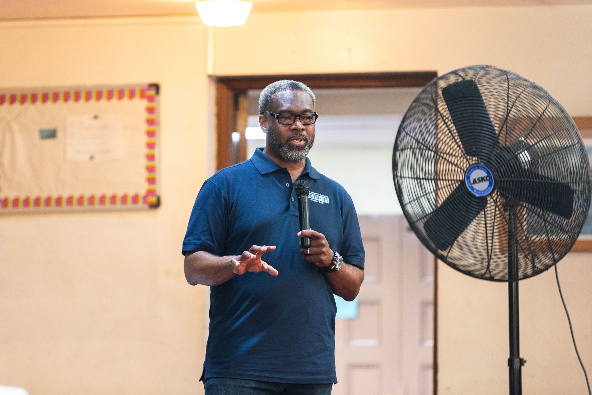 Caption: Councilperson James Tate at a community meeting this month. Photo: Courtesy of the city of