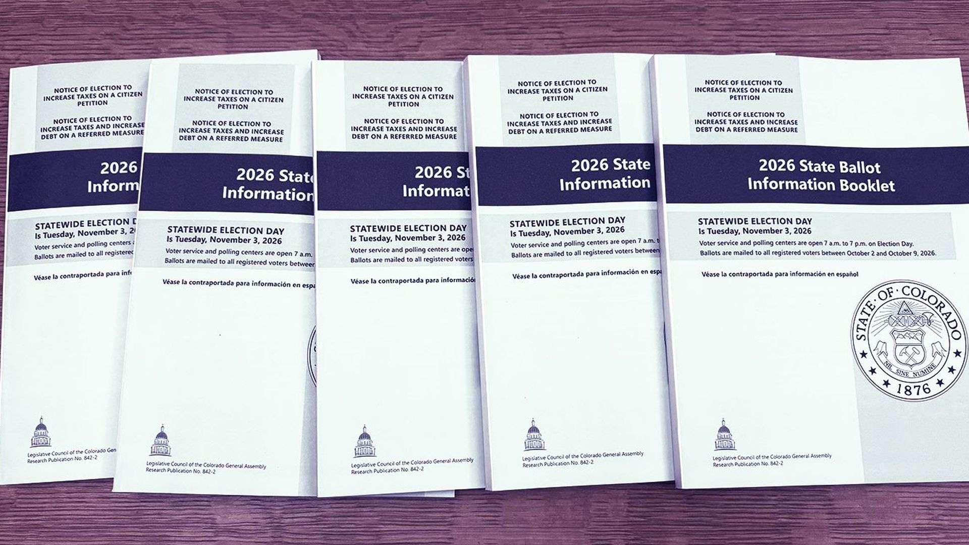 Picture of various samples of the nonpartisan voter guide on a surface