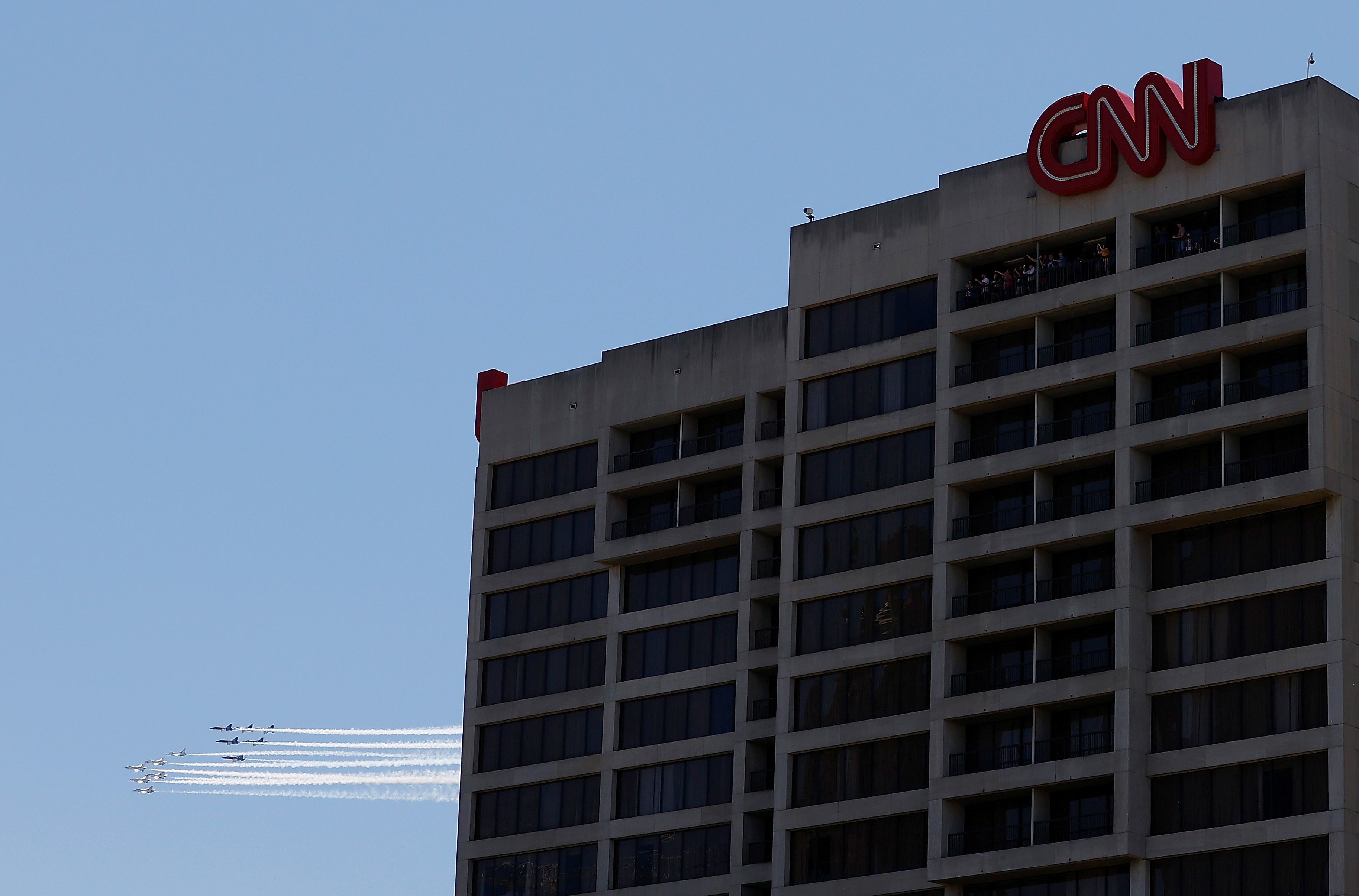 In this image, the Blue Angles fly past the CNN headquarters