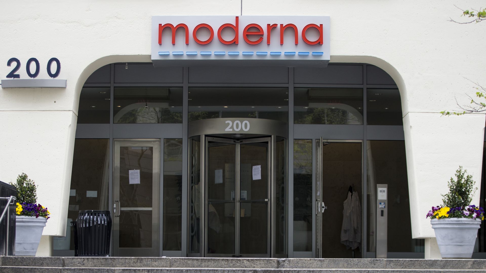 Moderna's red logo above doors at its headquarters building.