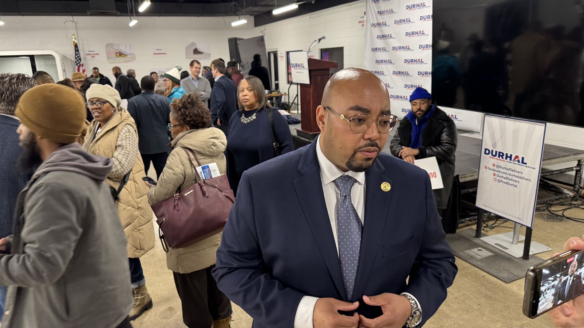 Durhal speaks with reporters.